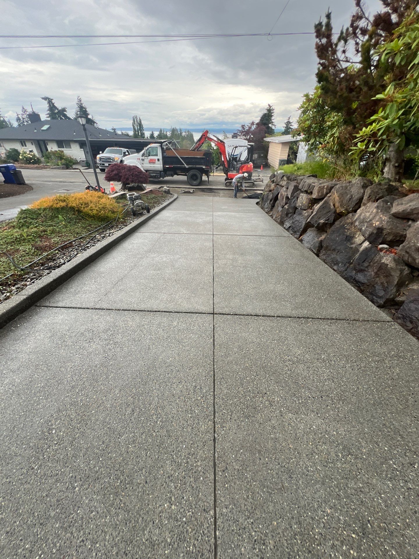 Concrete Driveway Makeover w/ Asphalt Patch | Everett  by Jireh Asphalt & Concrete Inc 