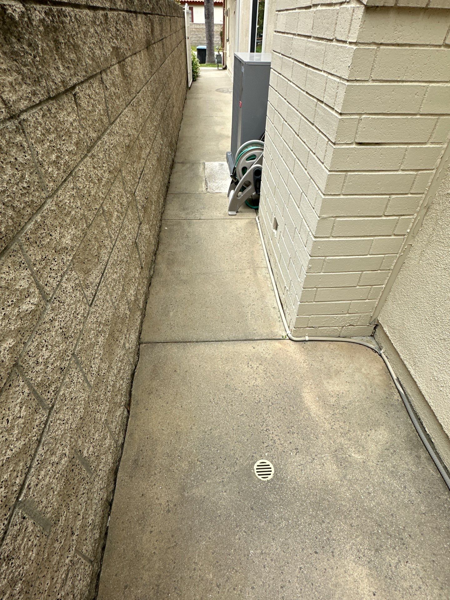 Surface cleaning pressure washing in Orange County on patio, walkways, and driveway by Property Cleaning Experts, LLC
