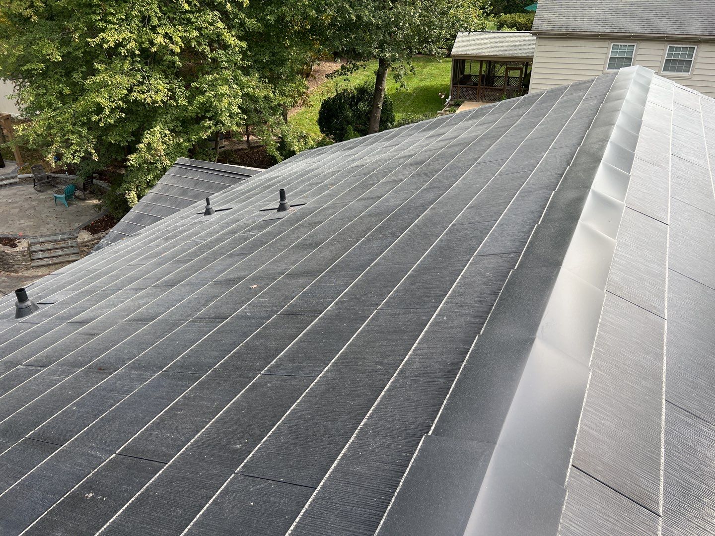 Tesla Solar Roof Replacement using Tesla Solar Roof V3 Tiles by American Home Contractors
