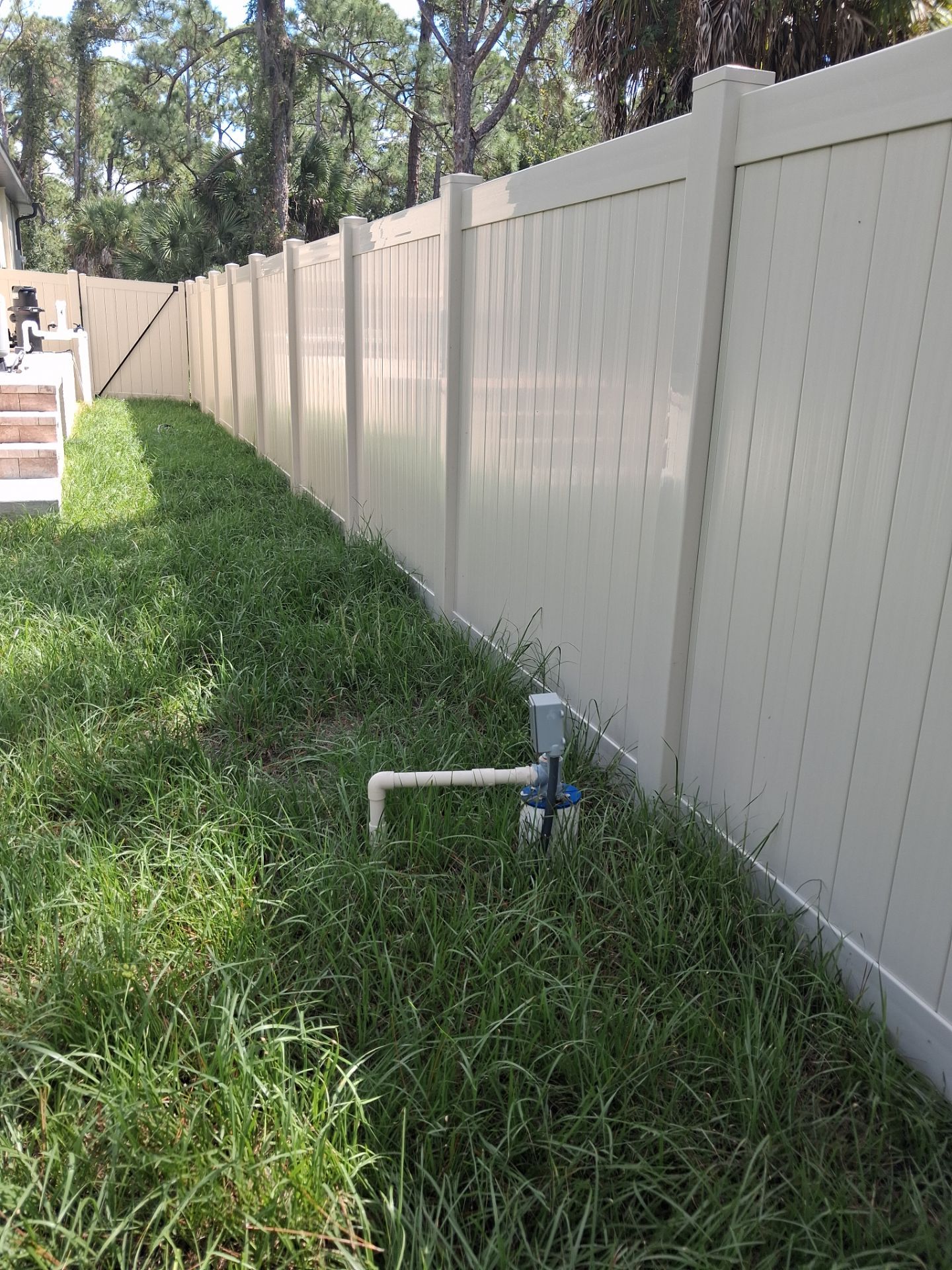 Tan Vinyl Privacy Fence and Gate Installation in Port Charlotte by True Fence LLC