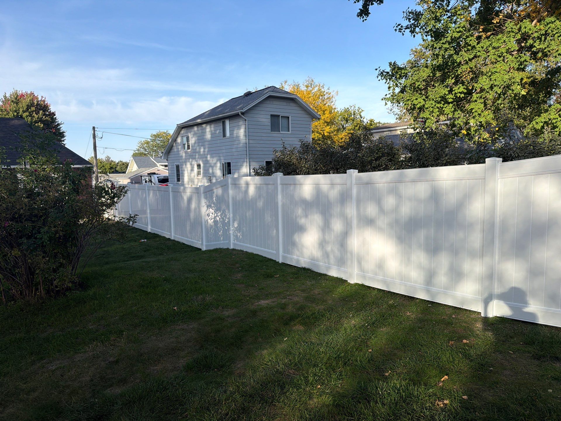 White Vinyl Privacy Fence and Gate Installation in Grundy Center by Perfect Picket Fence and Stain