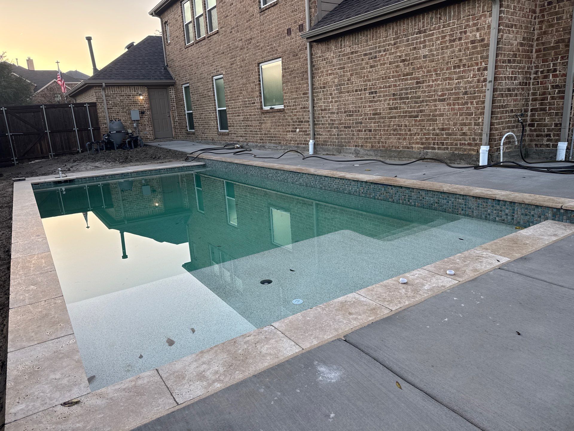 Contemporary Rectangular Pool with Travertine Coping by Pinnacle Pools and Spas - DFW
