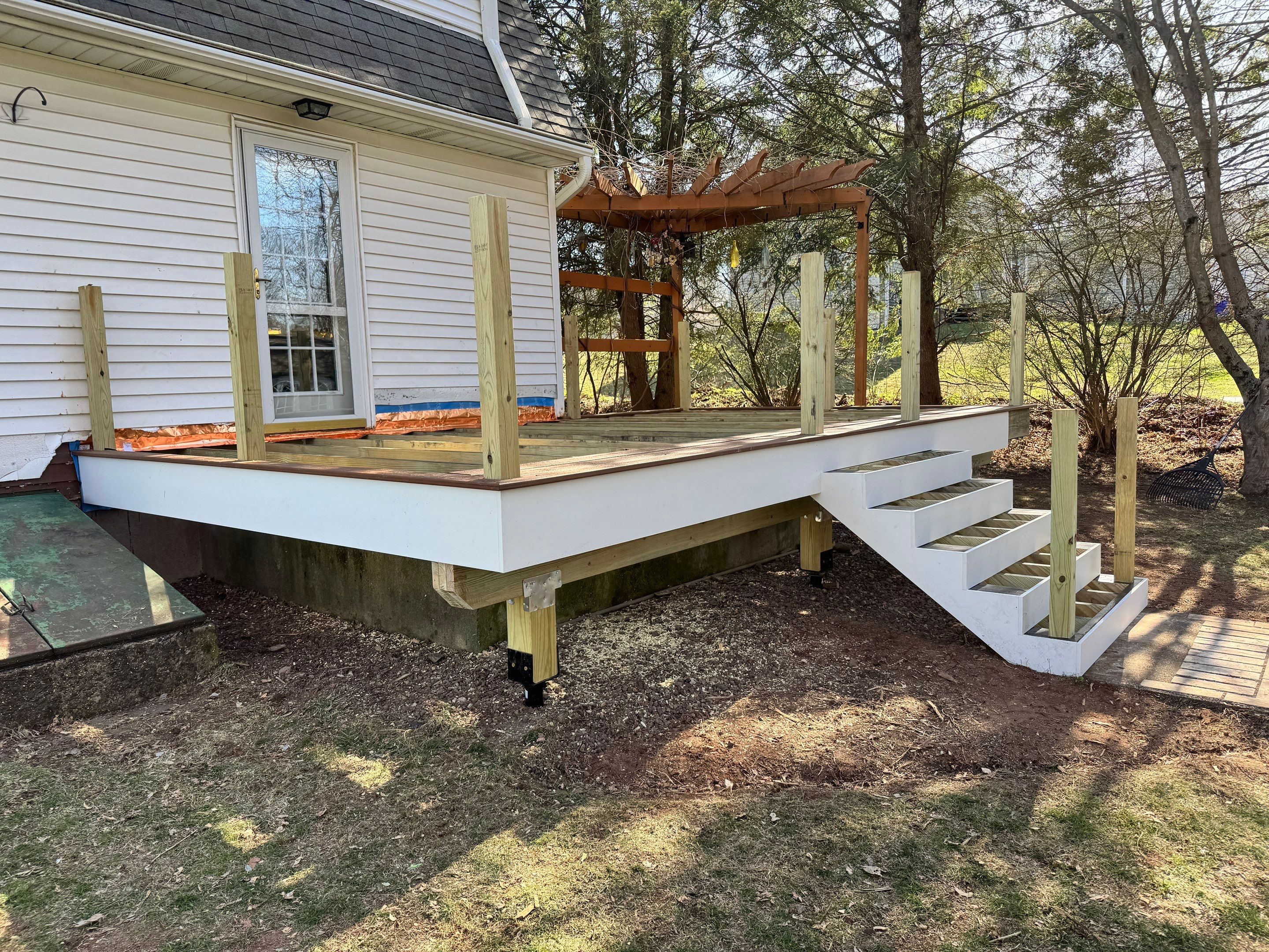 Replacement deck with Trex Transcend Tiki Torch deck boards and matching cocktail rail. by DiGiorgi Roofing and Siding Inc