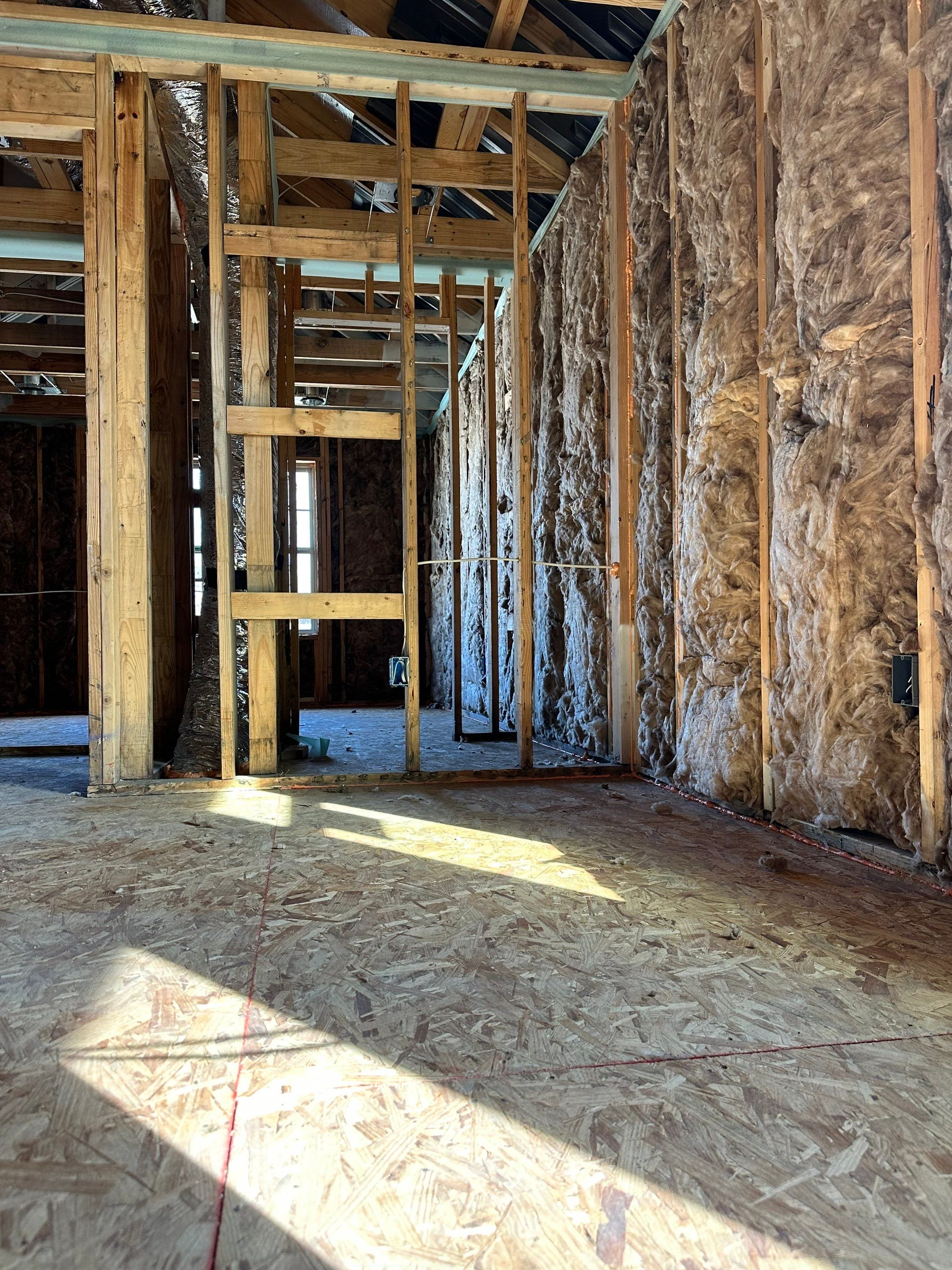 Fiberglass batt install on new construction home in Ft Worth by Apex Insulation Solutions