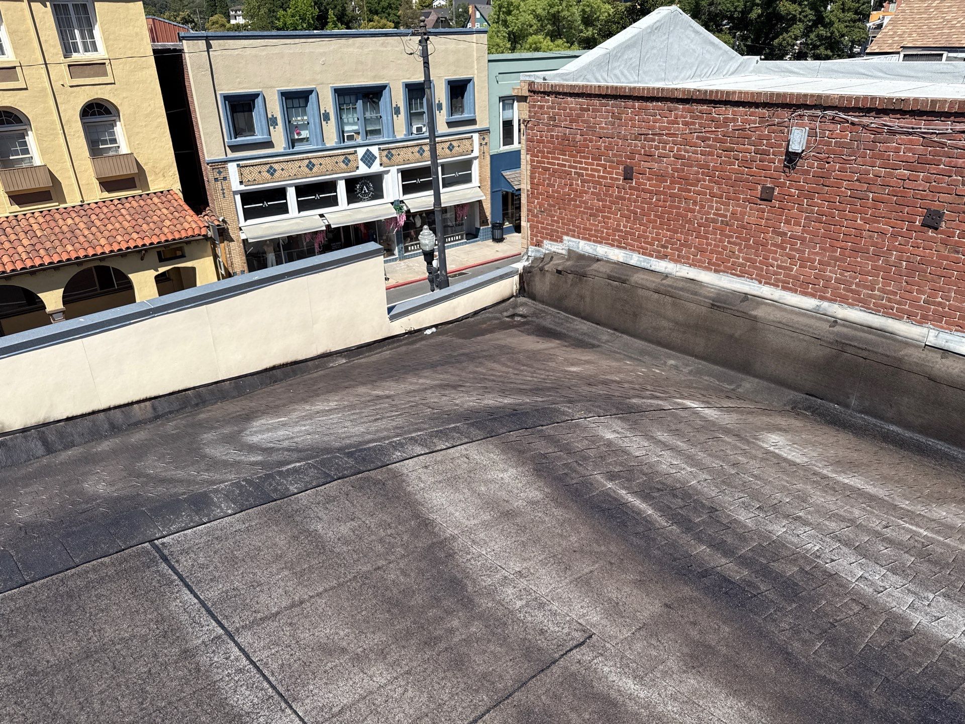 Foam and coatings on commercial roof by Straight Edge Roofing Inc