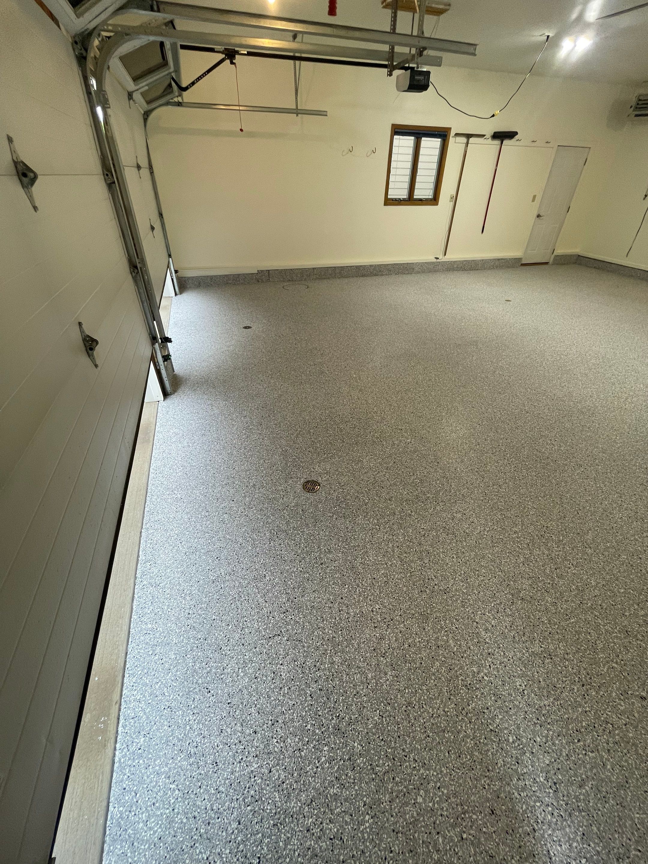 Madison Garage Concrete Coating with Feather Grey Speckle Finish by Select Painting, Coatings & Garage Cabinets