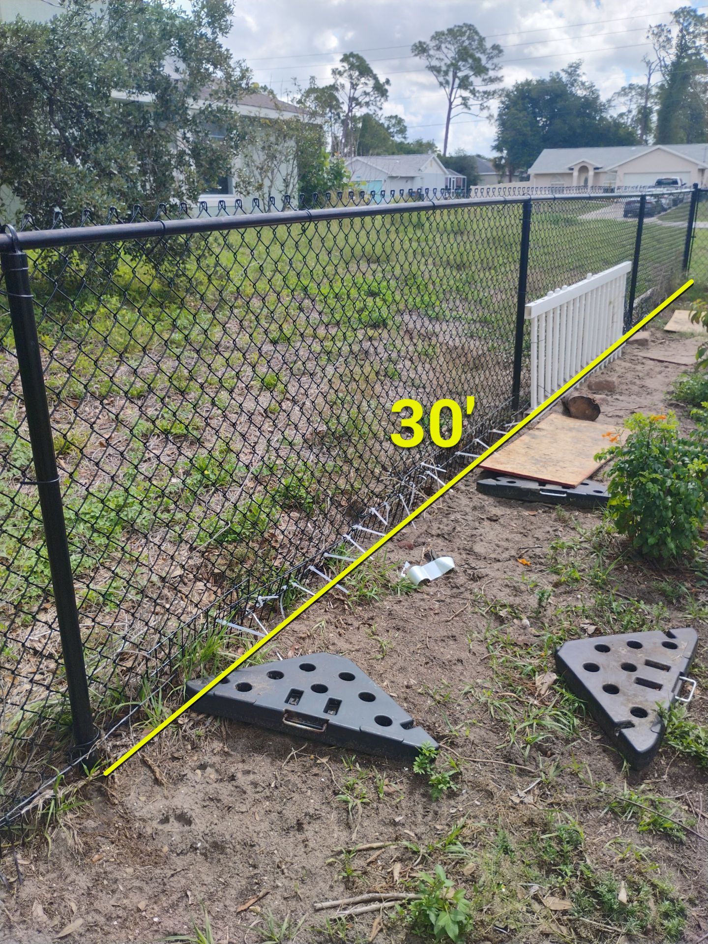 White and Gray Vinyl Privacy Fence Installation in North Port by True Fence LLC