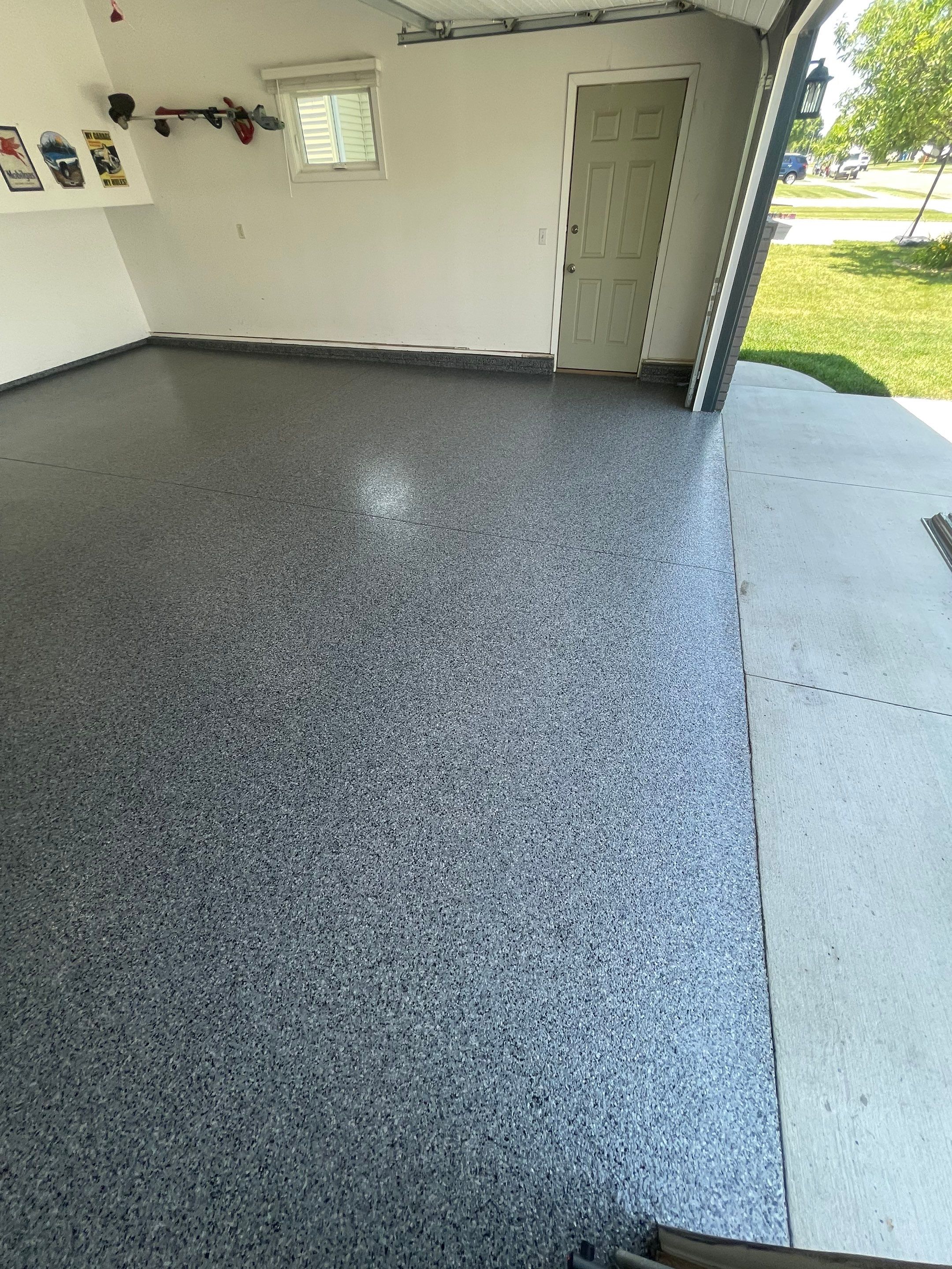 Sioux Falls Garage Floor Coating with Nightfall Decorative Chips by Select Painting, Coatings & Garage Cabinets