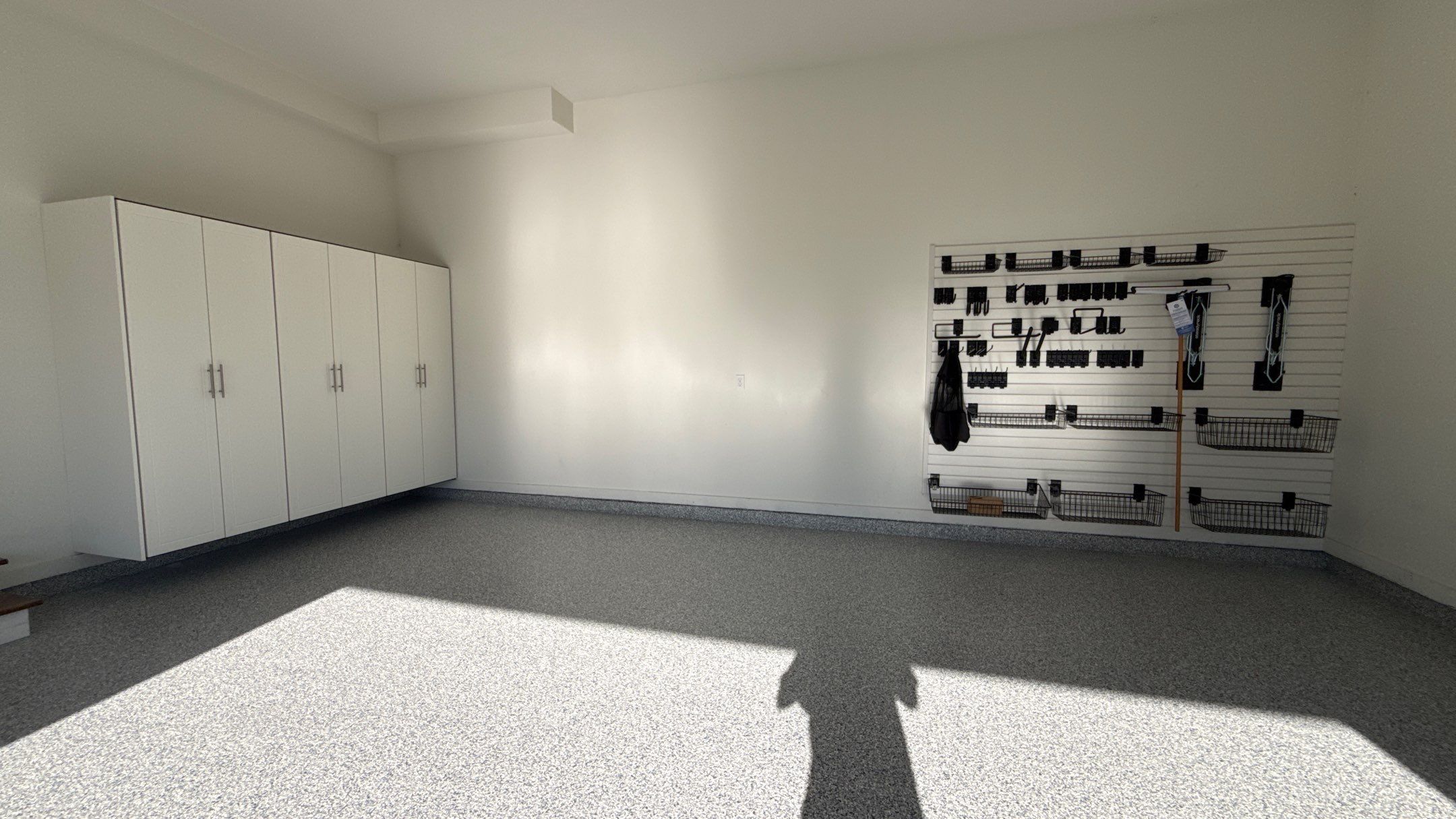 Garage Remodel with Custom Cabinets and Epoxy Floors in Overland Park by Banner Garage