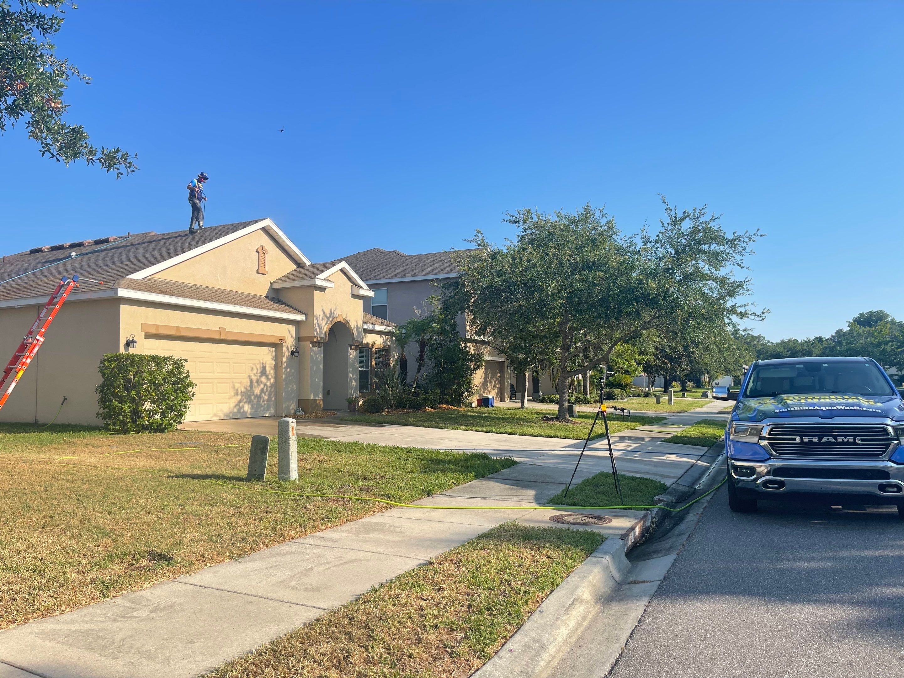 Asphalt Shingle Roof Soft Wash Cleaning & Concrete Pressure Washing in CopperStone Community, Parrish, FL by Sunshine AquaWash