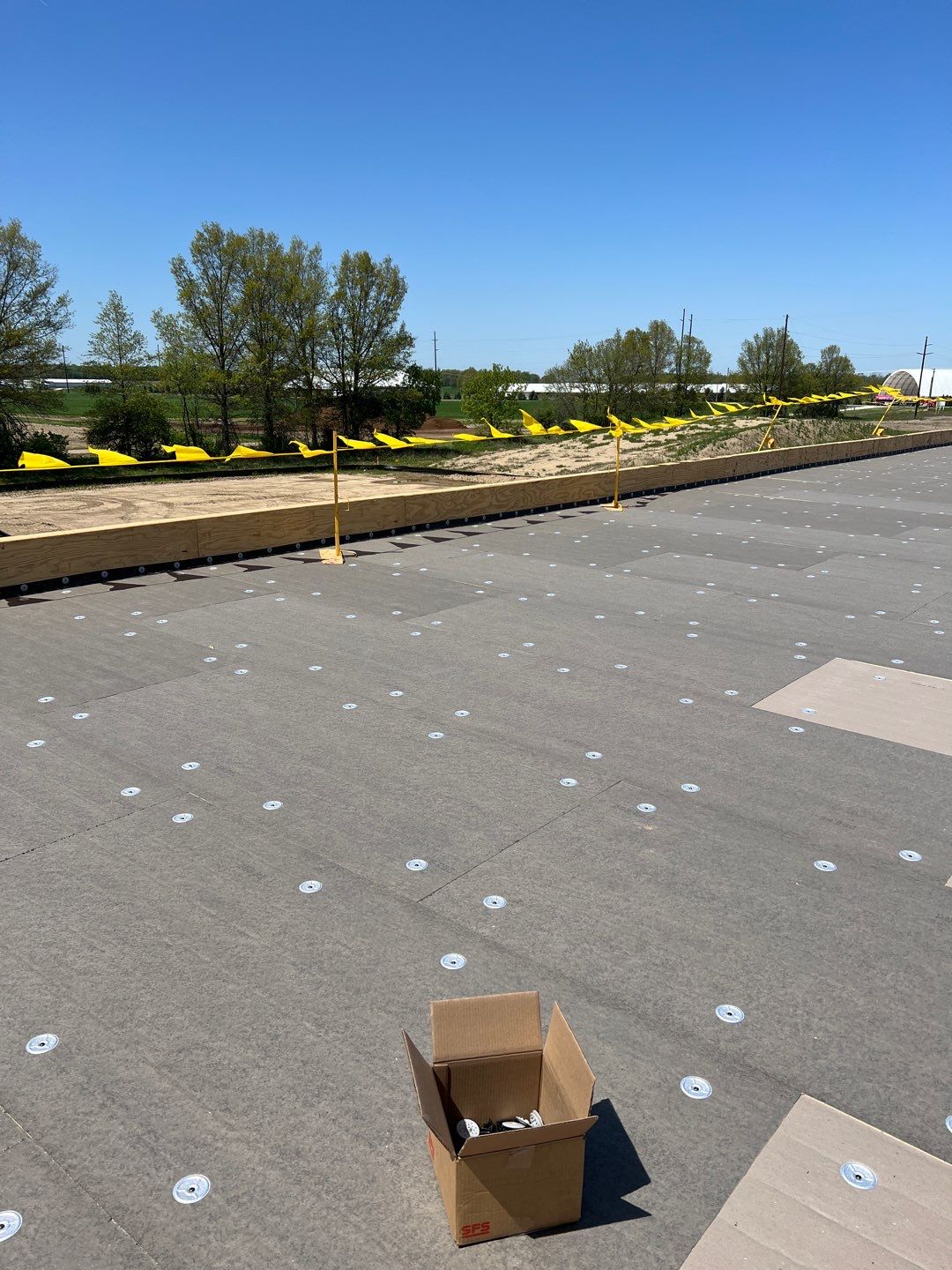 Commercial Roofing Installation using 60 mil rubber roof  by Nitro Roofing and Construction