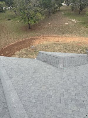 Architectural asphalt shingle roof with a hip section.