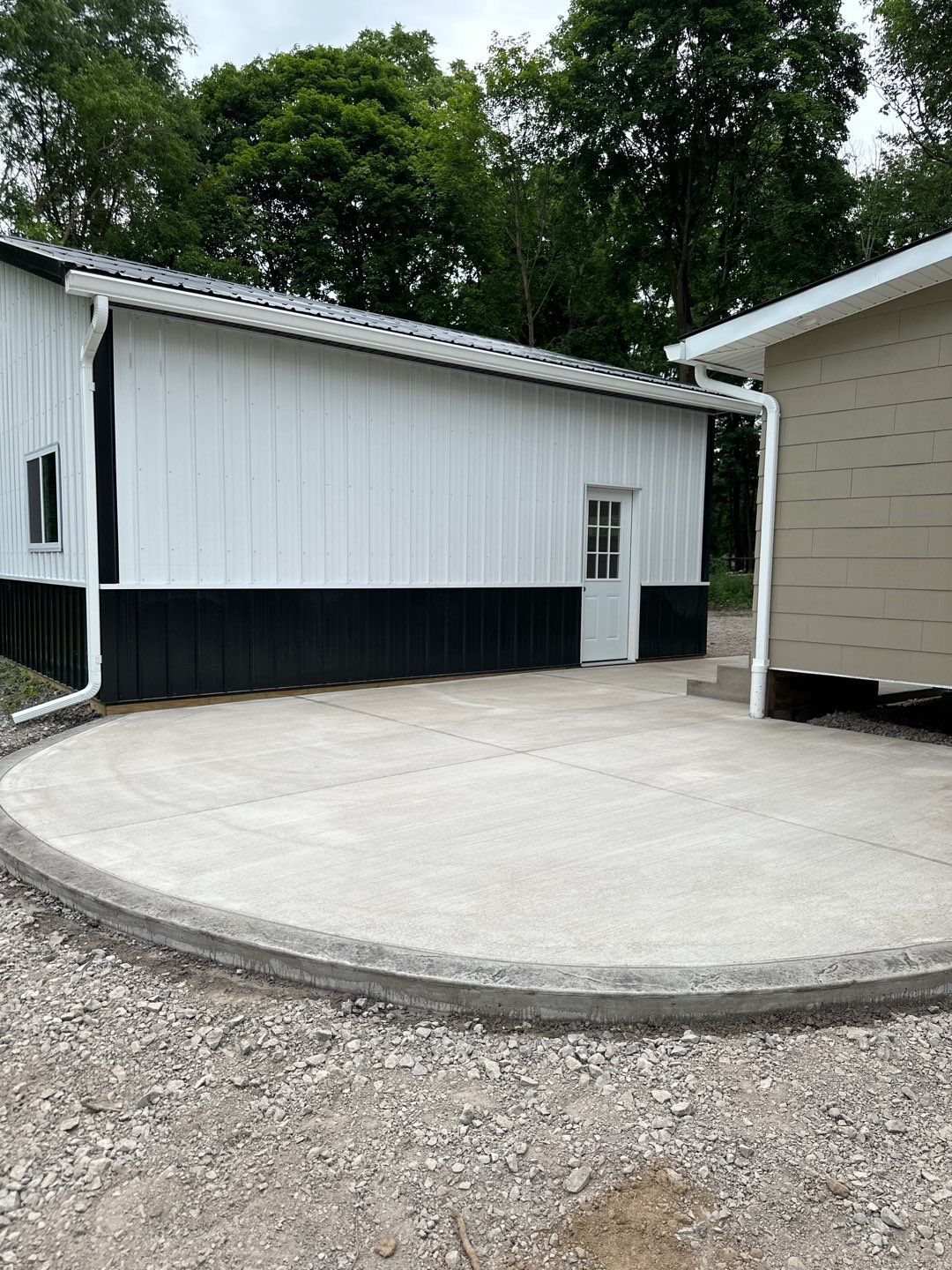 Broom finished concrete patio and sidewalk  by NG Masonry & Construction LLC