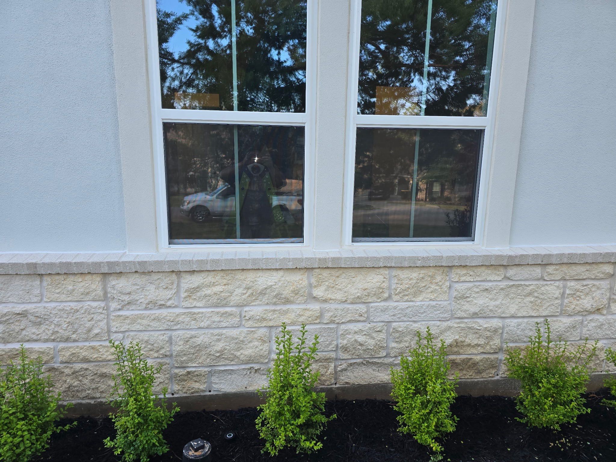 Conroe Elegance: Stucco, Foam Corbels, and Natural Stone Accents. by Apex Conventional Stucco Llc