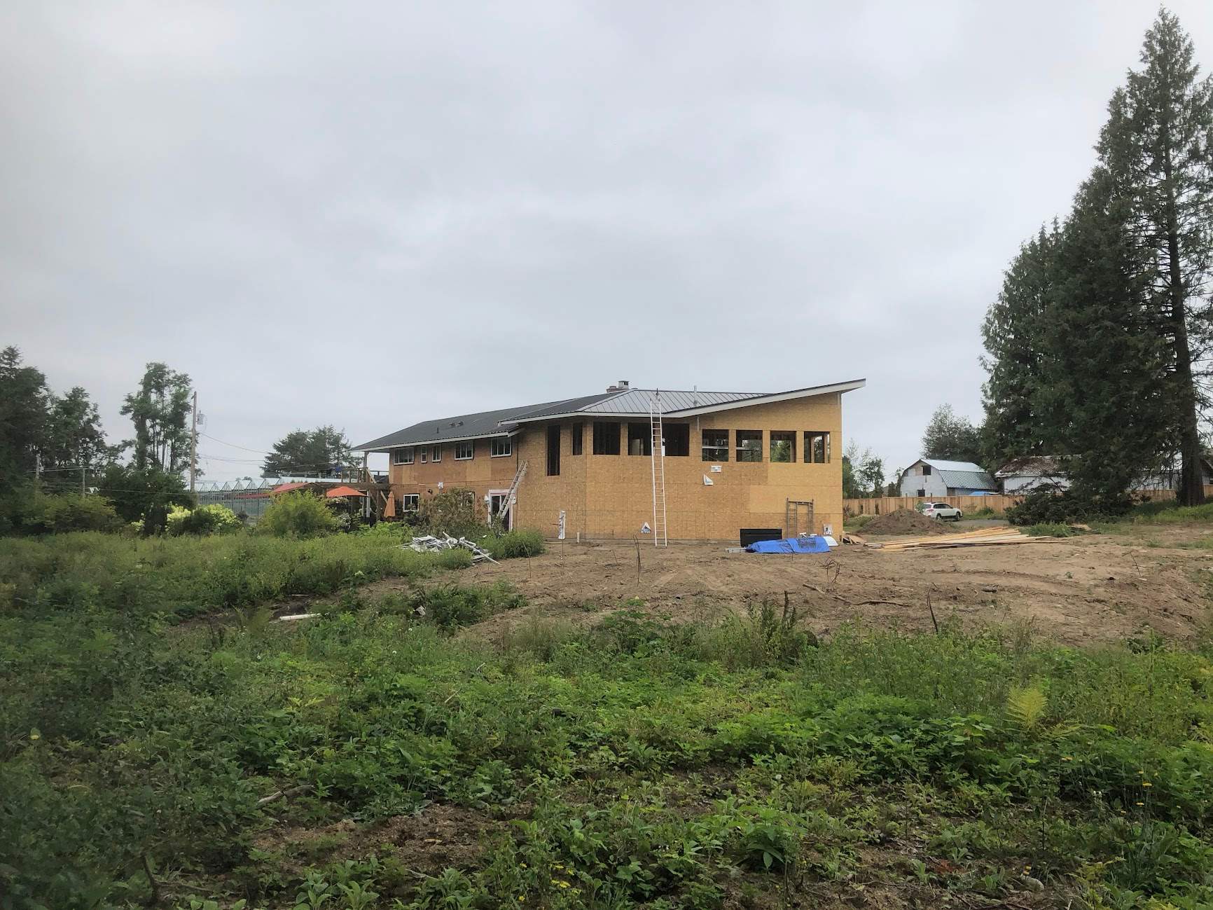 Residential Roofing Installation using 12" Prolok metal  by Top Notch Roofing Inc