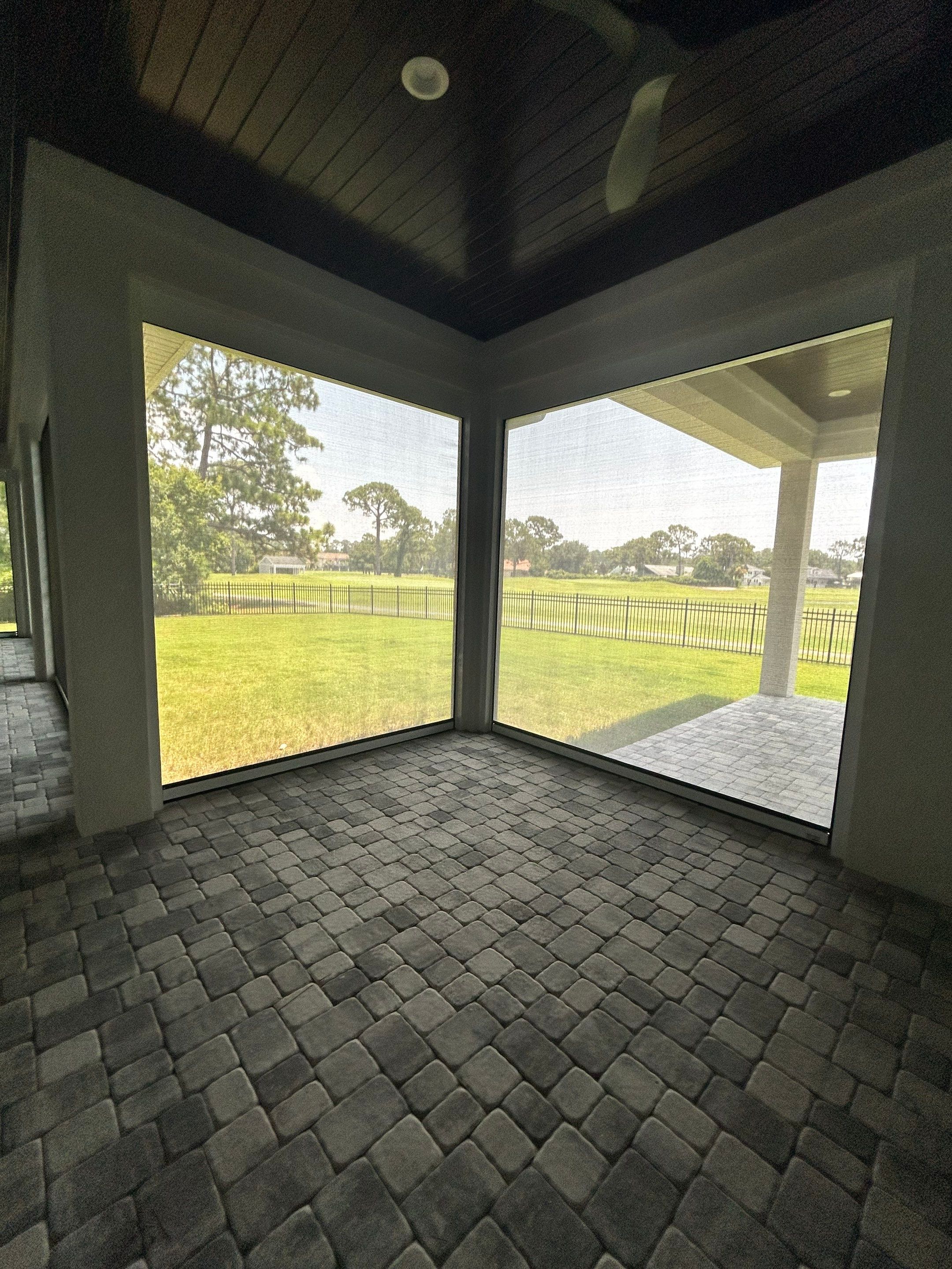 Motorized Screen and Solar Shade Installation in Panama City Beach by Brannan Aluminum Inc.