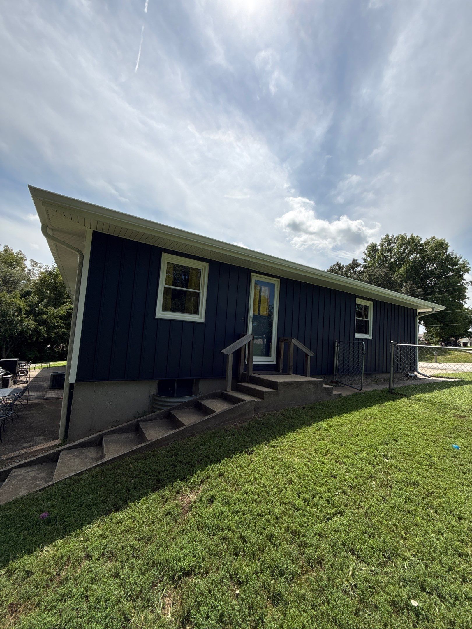 Indigo Board and Batten Siding and Window Replacement in Smithville by EEC Windows, Siding & Roofing