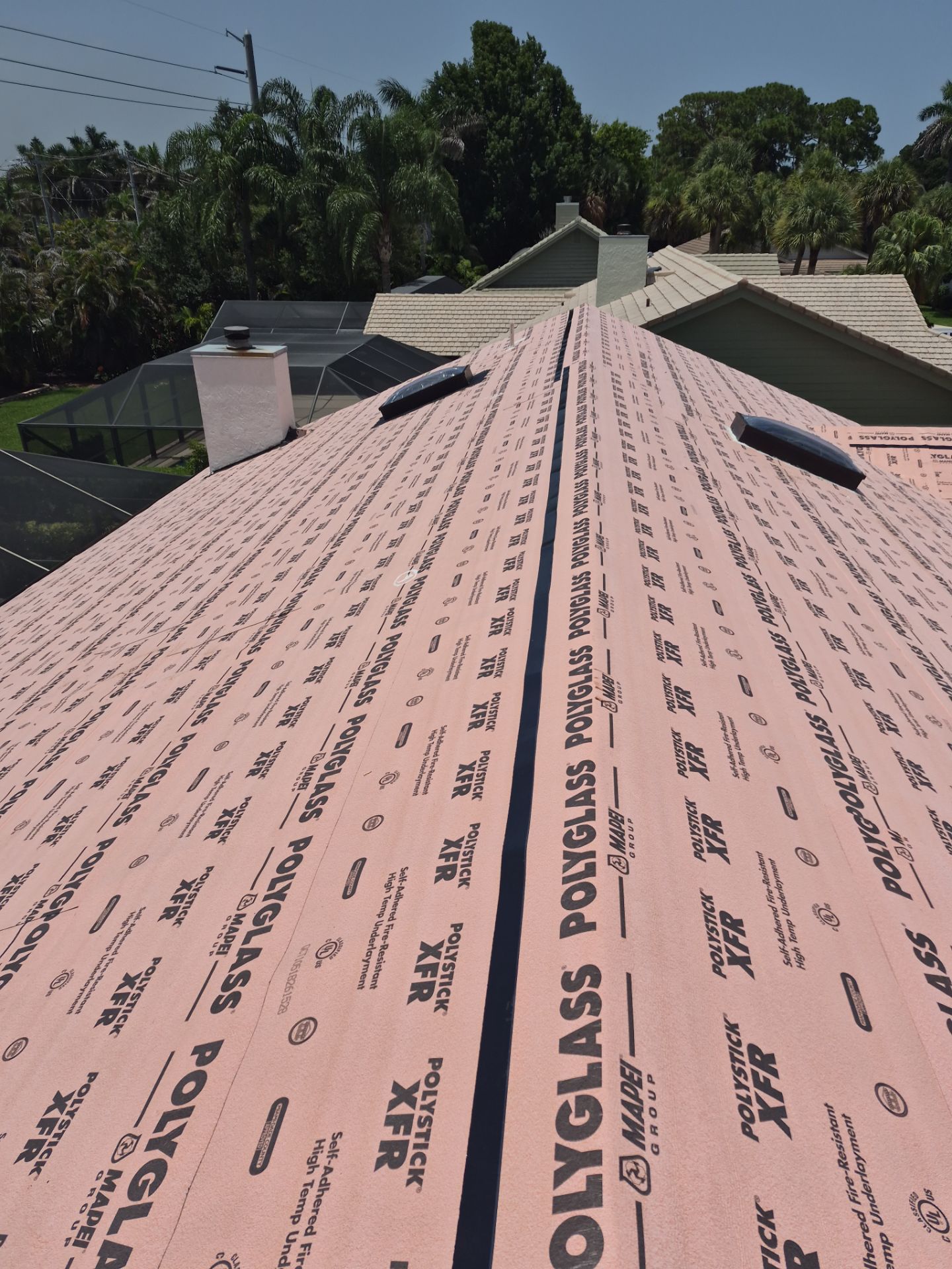 Standing Seam Metal Charcoal Grey Roof Replacement and Skylight Installation in Jupiter by Art's Roofing & Construction
