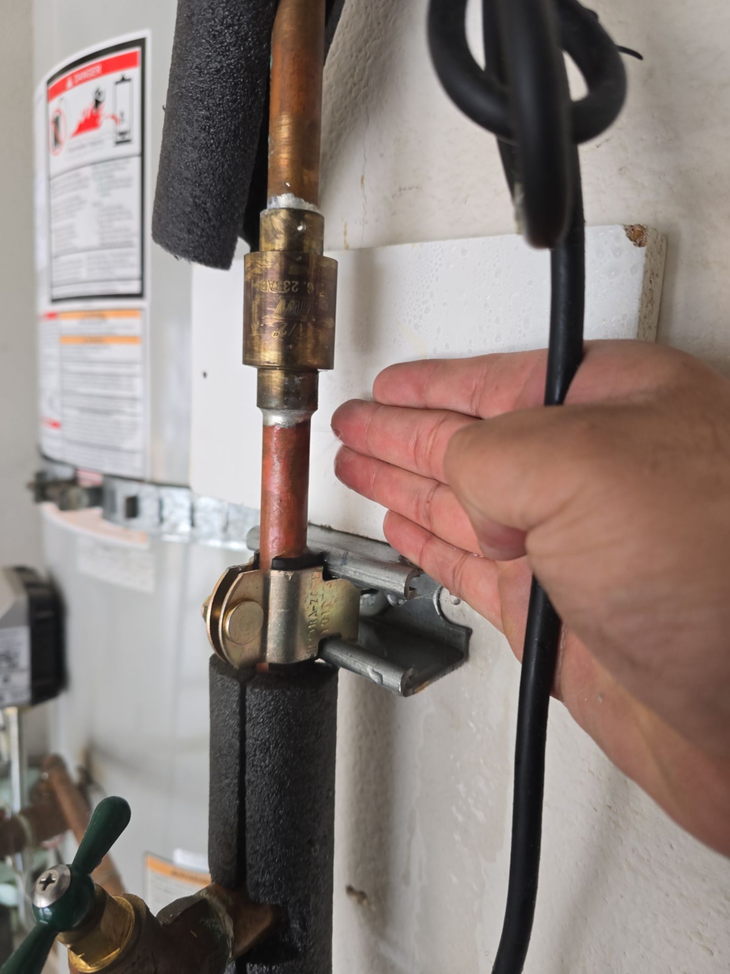 Fixing Water Leak by Us Plumbing