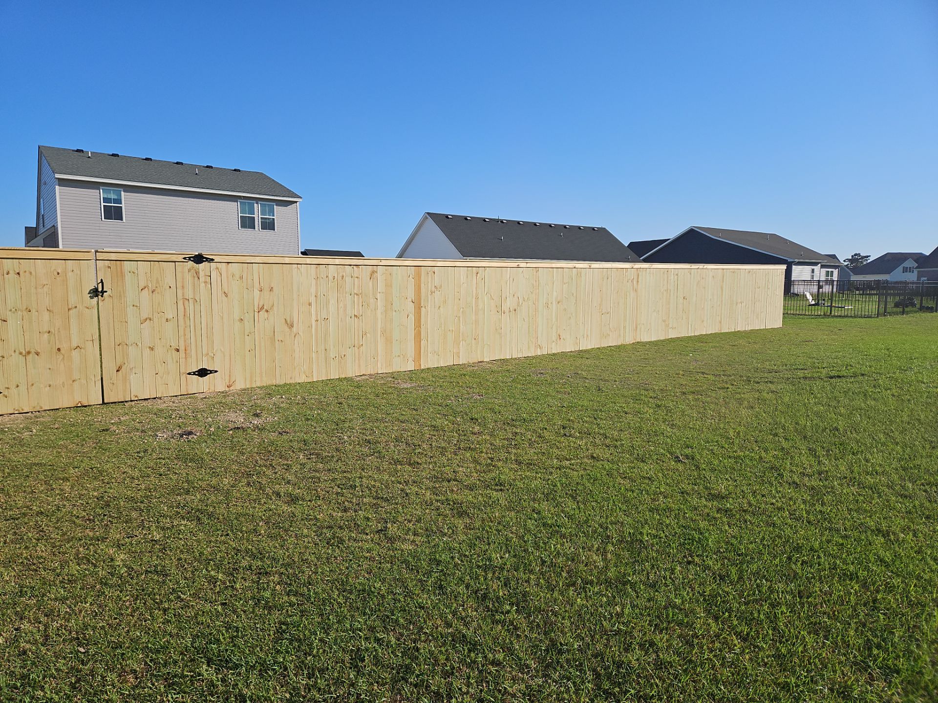 Stronger. Sleeker. Wood. by Tidewater Fence