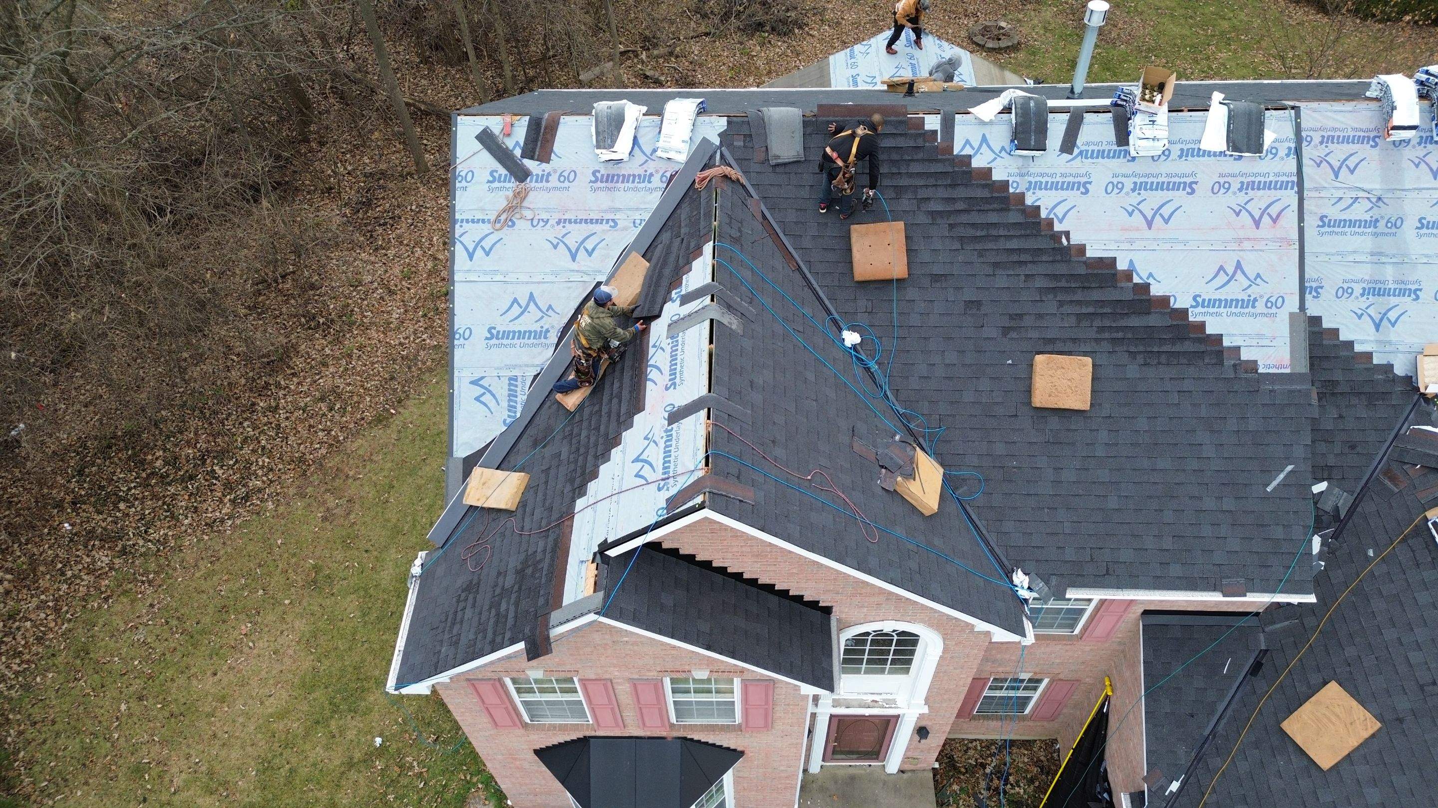 Walden Ponds - Pristine Black and Hydro Flo Gutter Guards by Tamlin Roofing