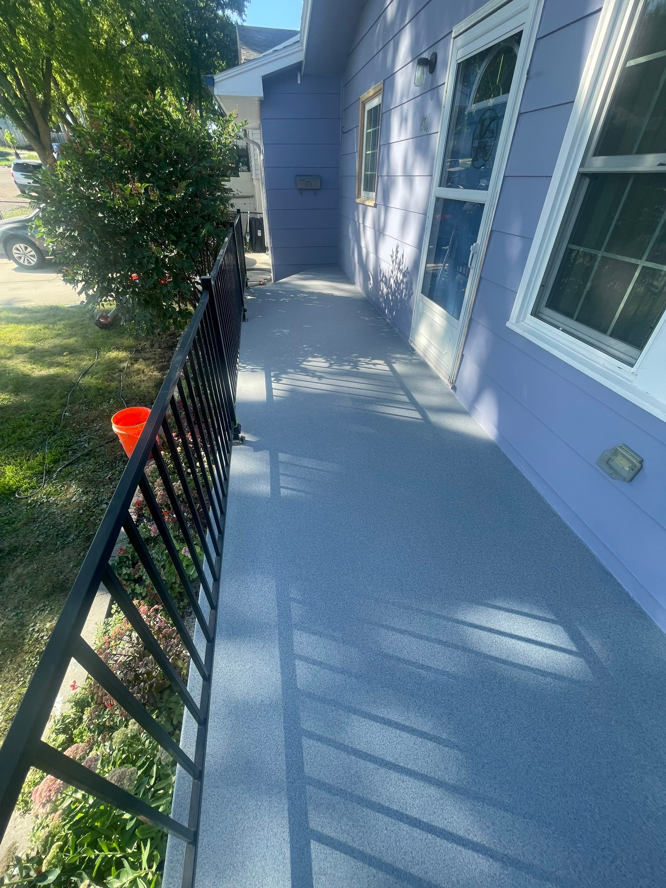 Sioux Falls Concrete Porch Coating with Starry Evening Finish by Select Painting, Coatings & Garage Cabinets