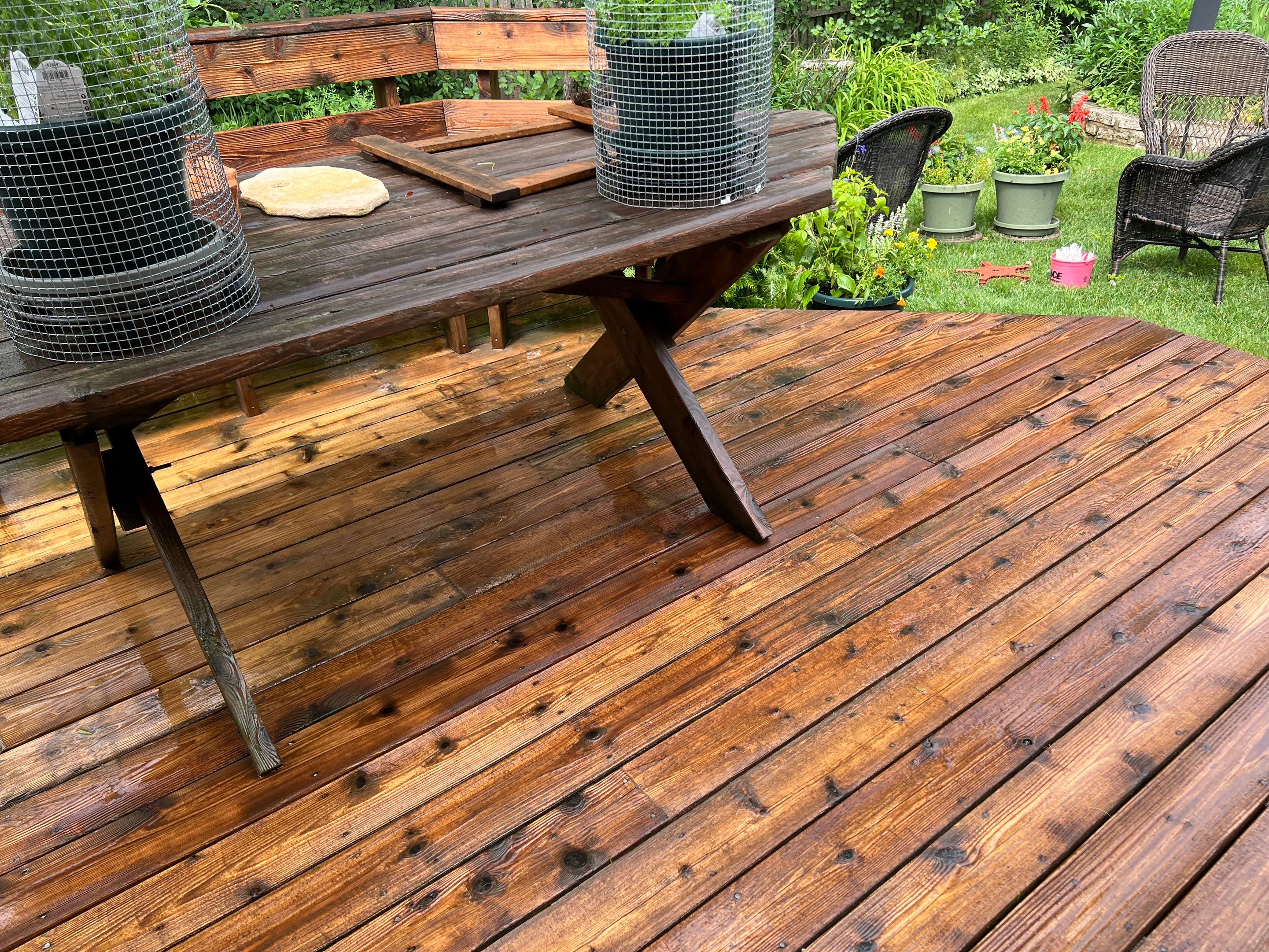 Wood deck cleaning, board replacement and staining by Northern Power Washing LLC.