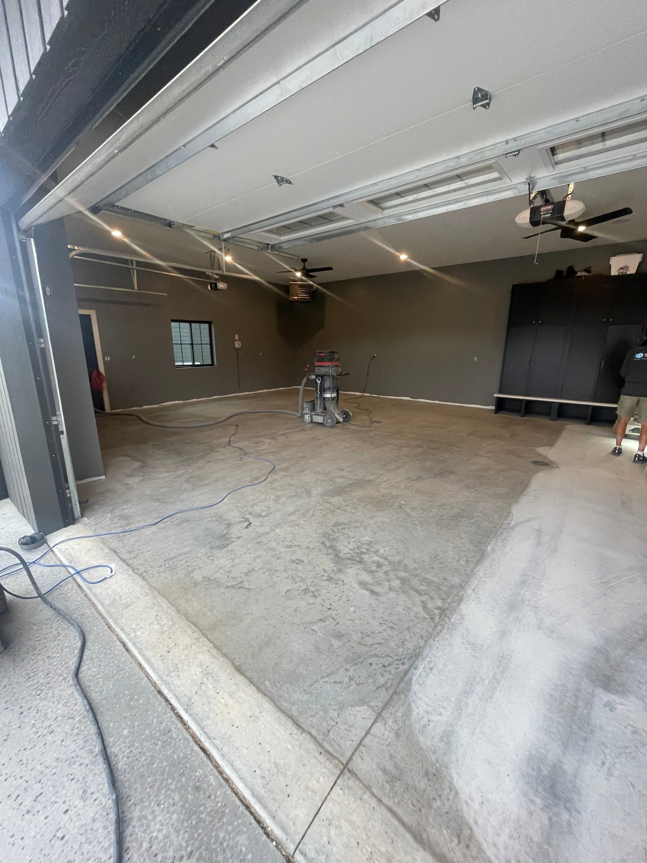 Custom Speckled Concrete Coating for Dell Rapids Garage by Select Painting, Coatings & Garage Cabinets