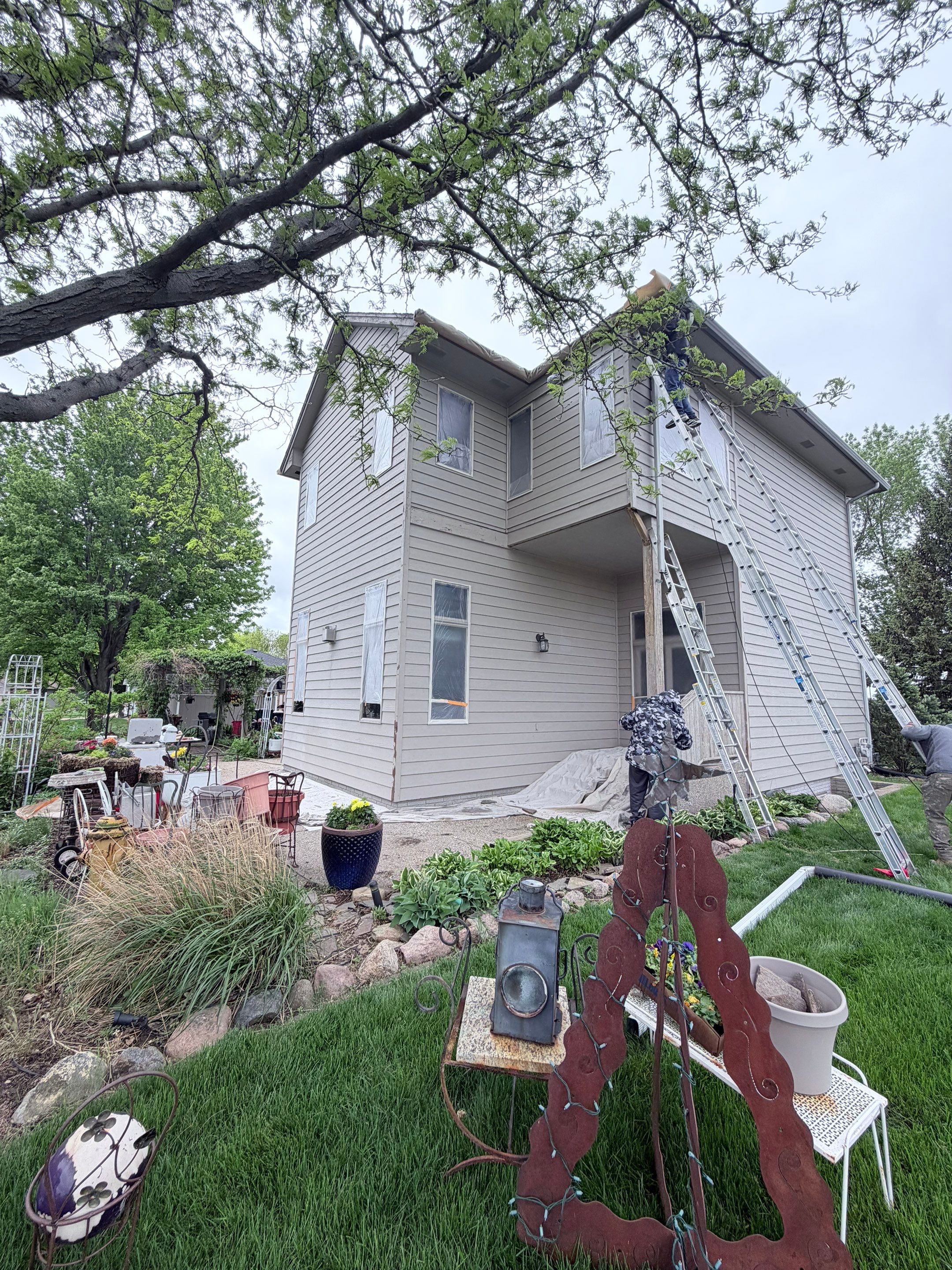 Exterior Siding and Trim Painting for Sioux Falls Residence by Select Painting, Coatings & Garage Cabinets