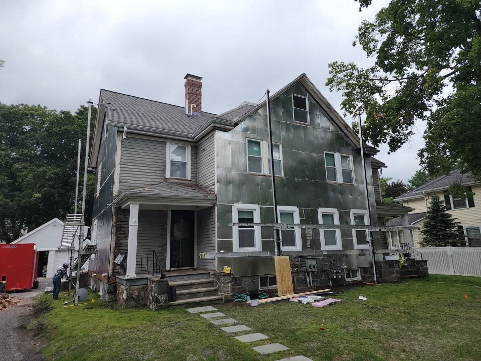 Vinyl siding layover project for 2 family in Wellesley, MA by UBrothers Construction