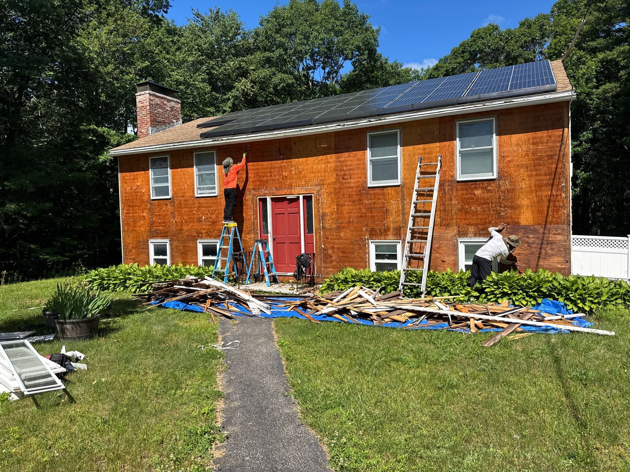 Full Siding Replacement in Newmarket, NH with CertainTeed Vinyl Siding and New Front Door Installation by Compass exteriors