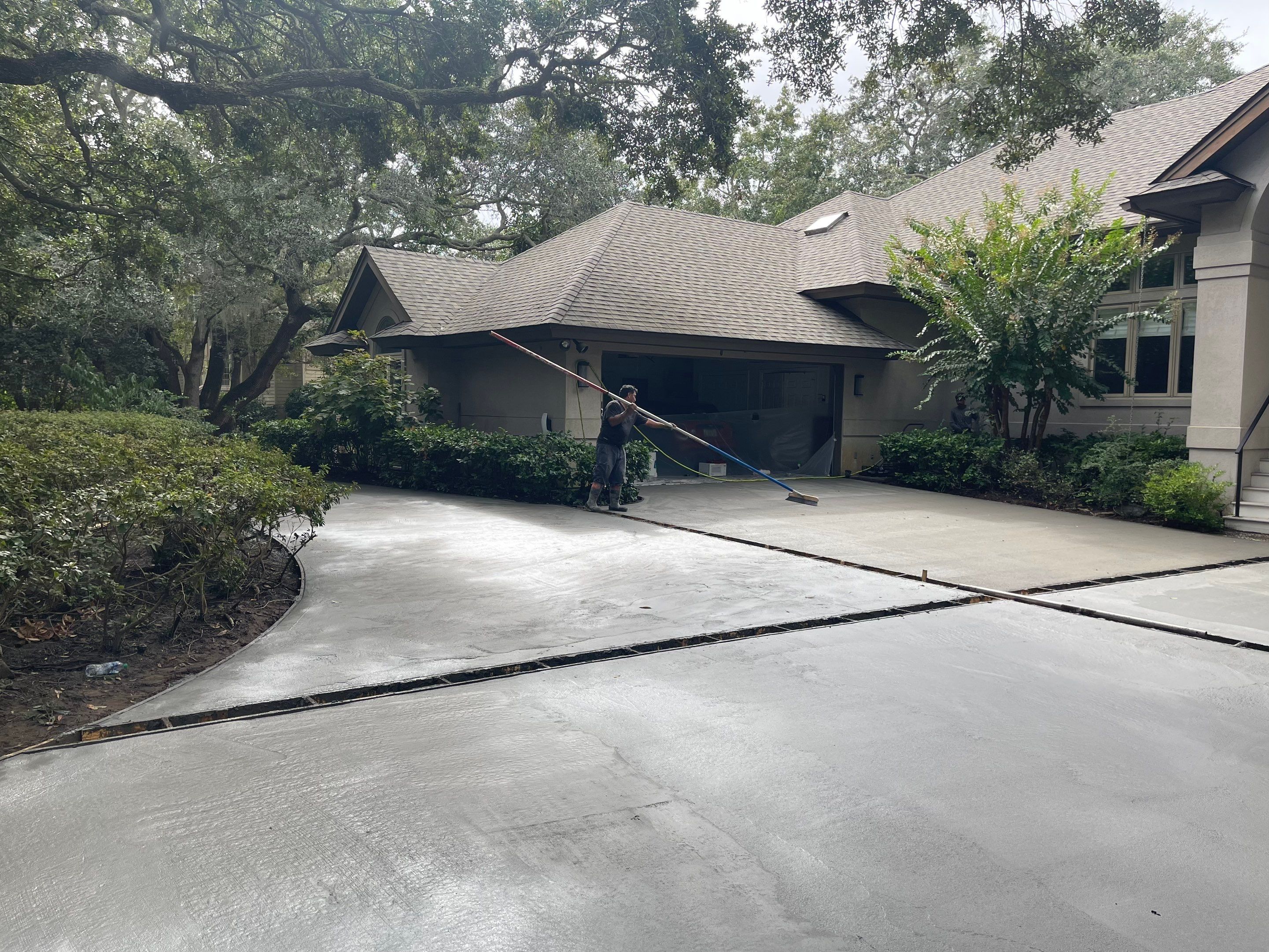 Custom Concrete Driveway with Decorative Paver Inlays in Hilton Head Island by Lowcountry Scapes, LLC