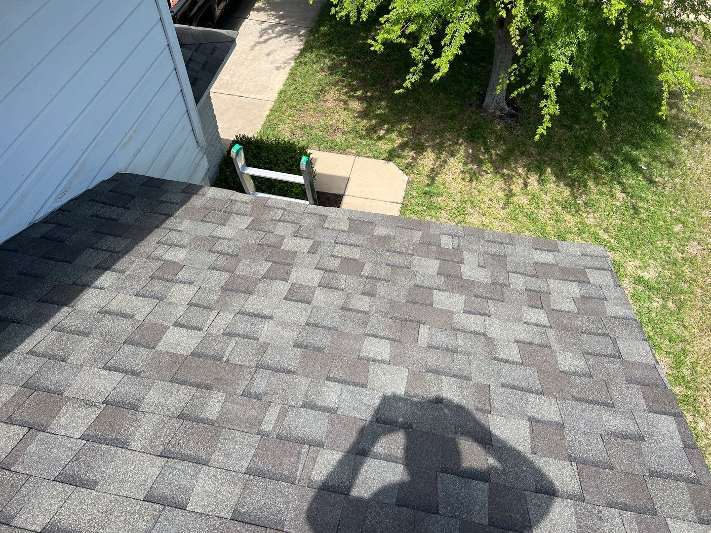 Wind damaged roof replacement by Oakwood Roofing and Construction, LLC