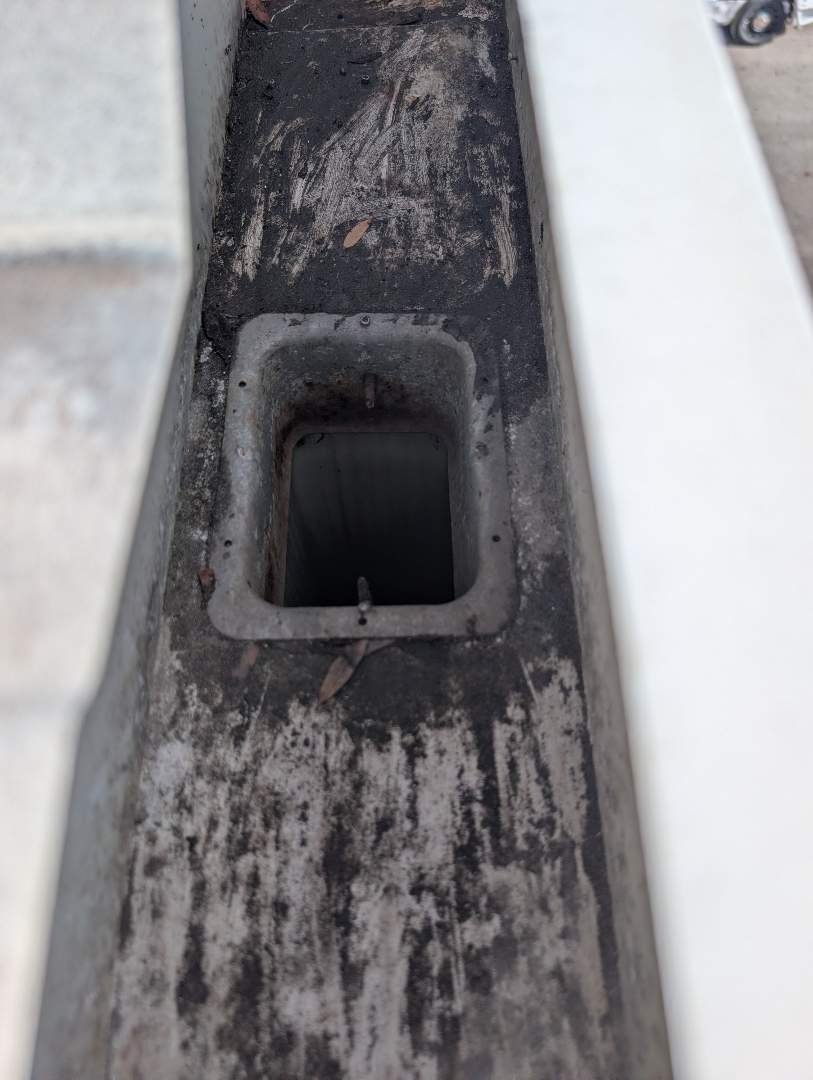 Retail roof & gutter cleaning before cleaning photo.