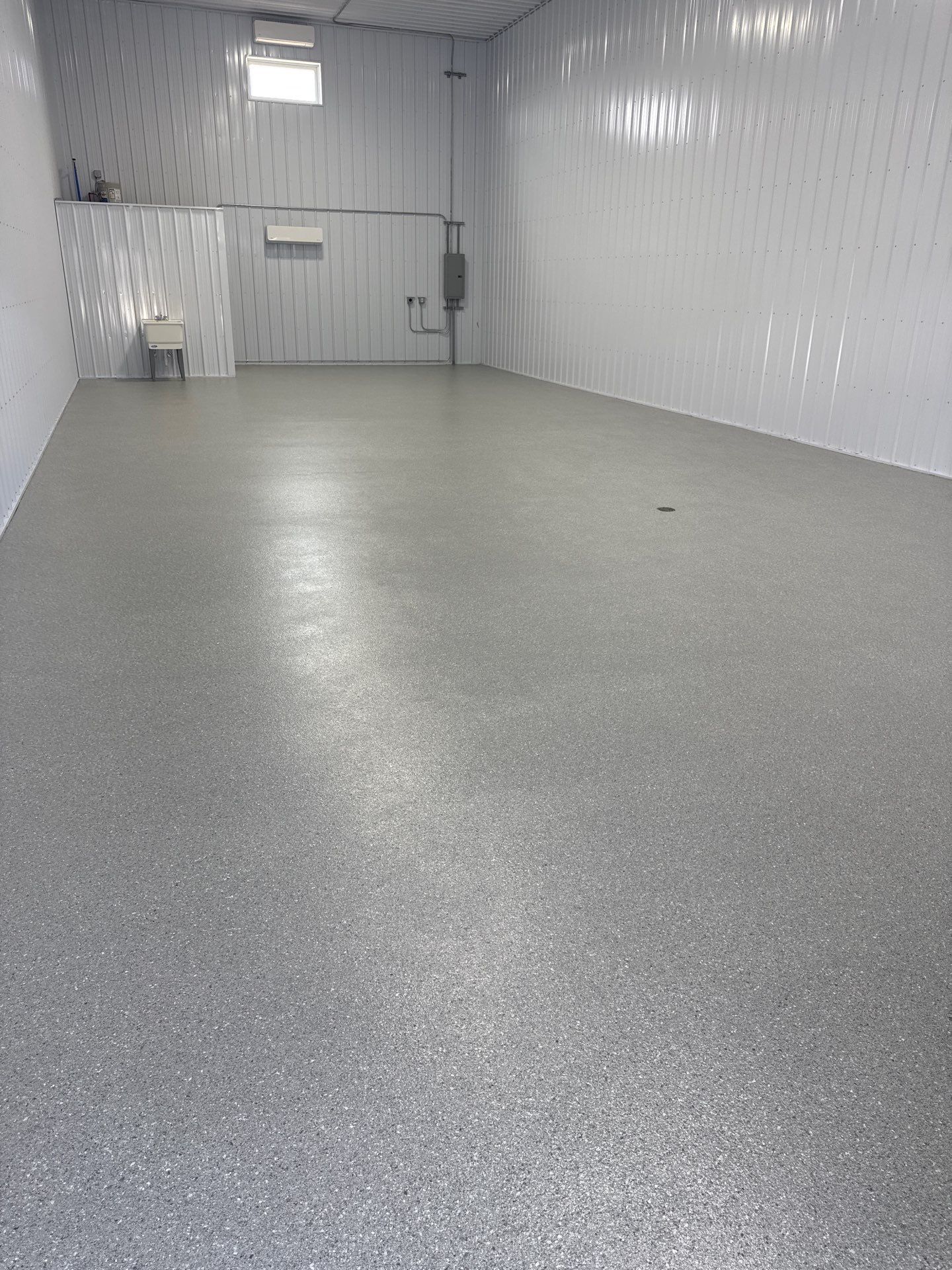 Commercial Storage Bay Epoxy Flake Floor Installation in North Muskegon by Gordon Painting