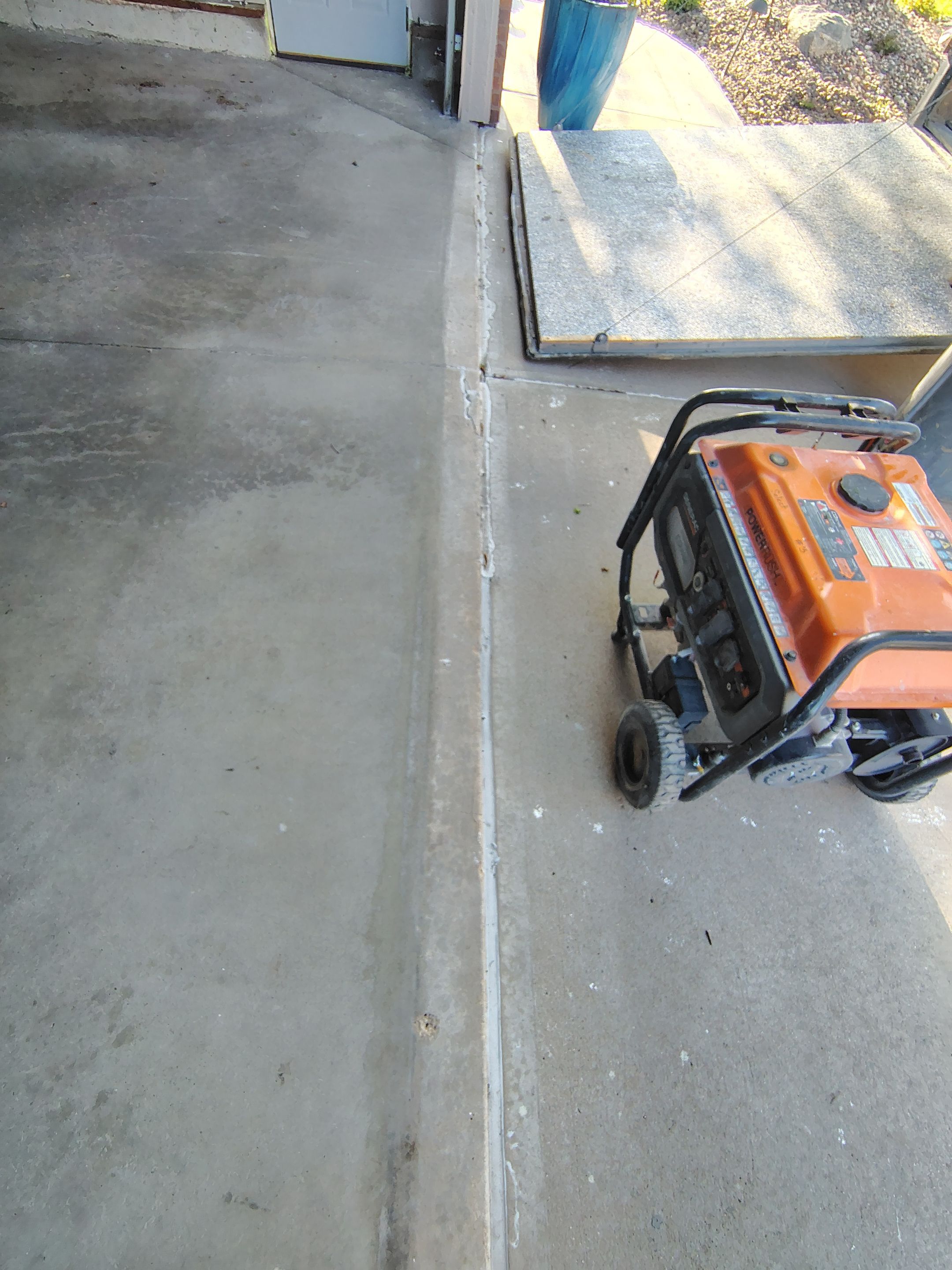 Sioux Falls Garage Concrete Repair and Epoxy Flake Floor Coating by Select Painting, Coatings & Garage Cabinets