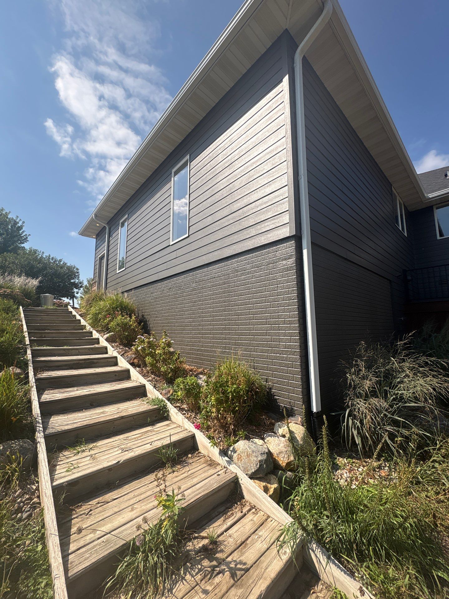 Sioux Falls Residential Exterior Painting and Siding Refresh by Select Painting, Coatings & Garage Cabinets