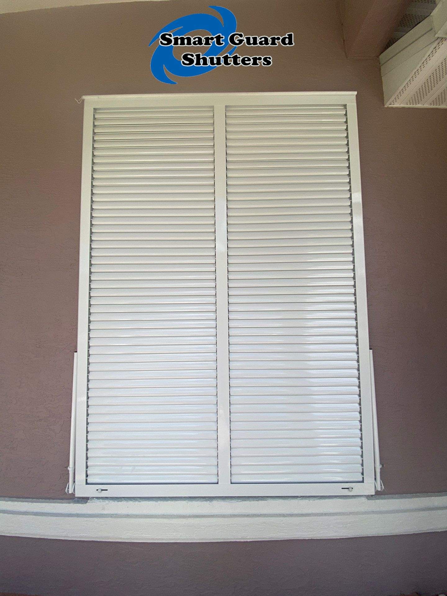 Impact Bahama Shutters in Signal White by Smart Guard Shutters