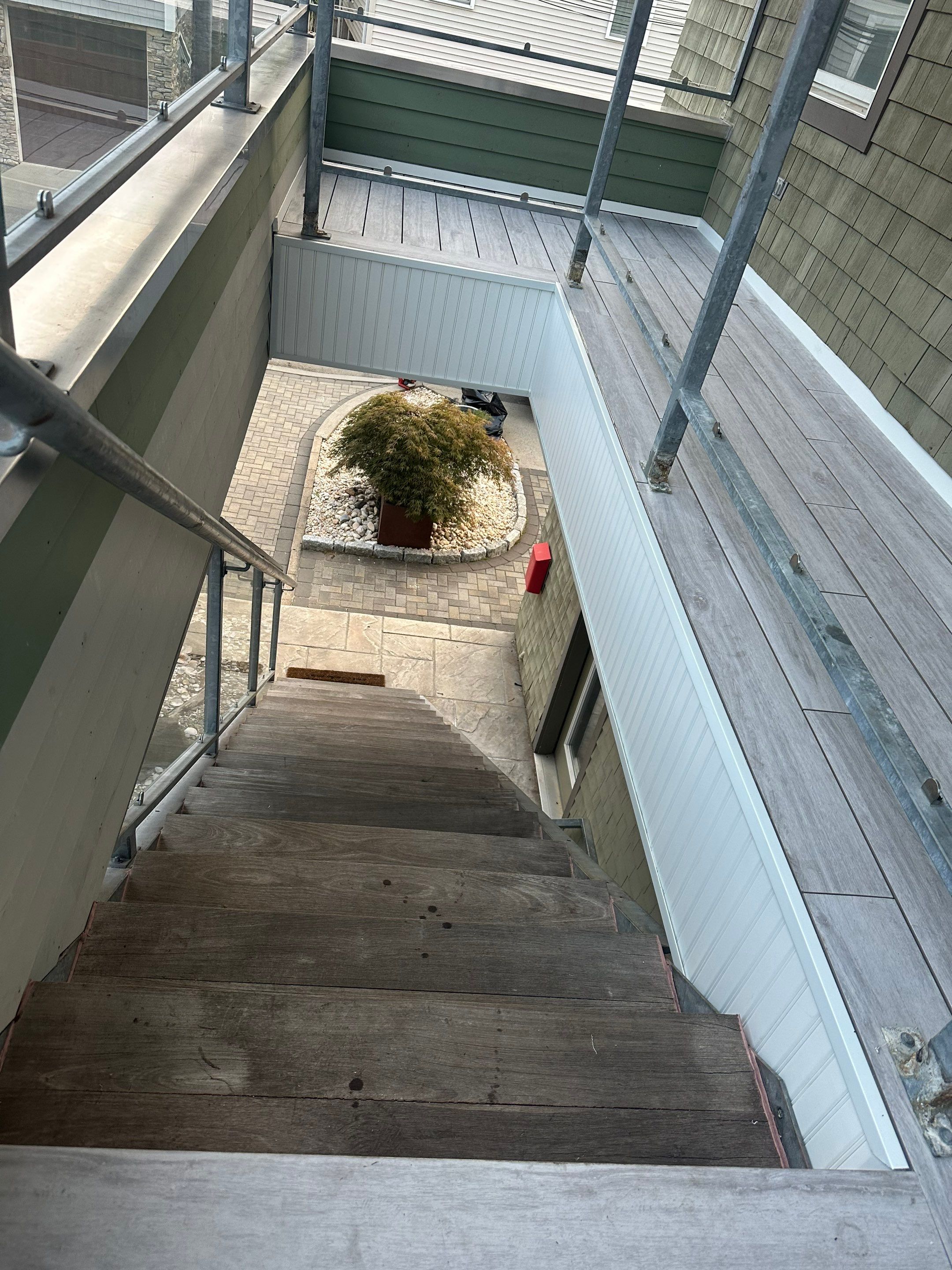 Deck Installation using Tanzite Stone Decking by A Plus Exterior