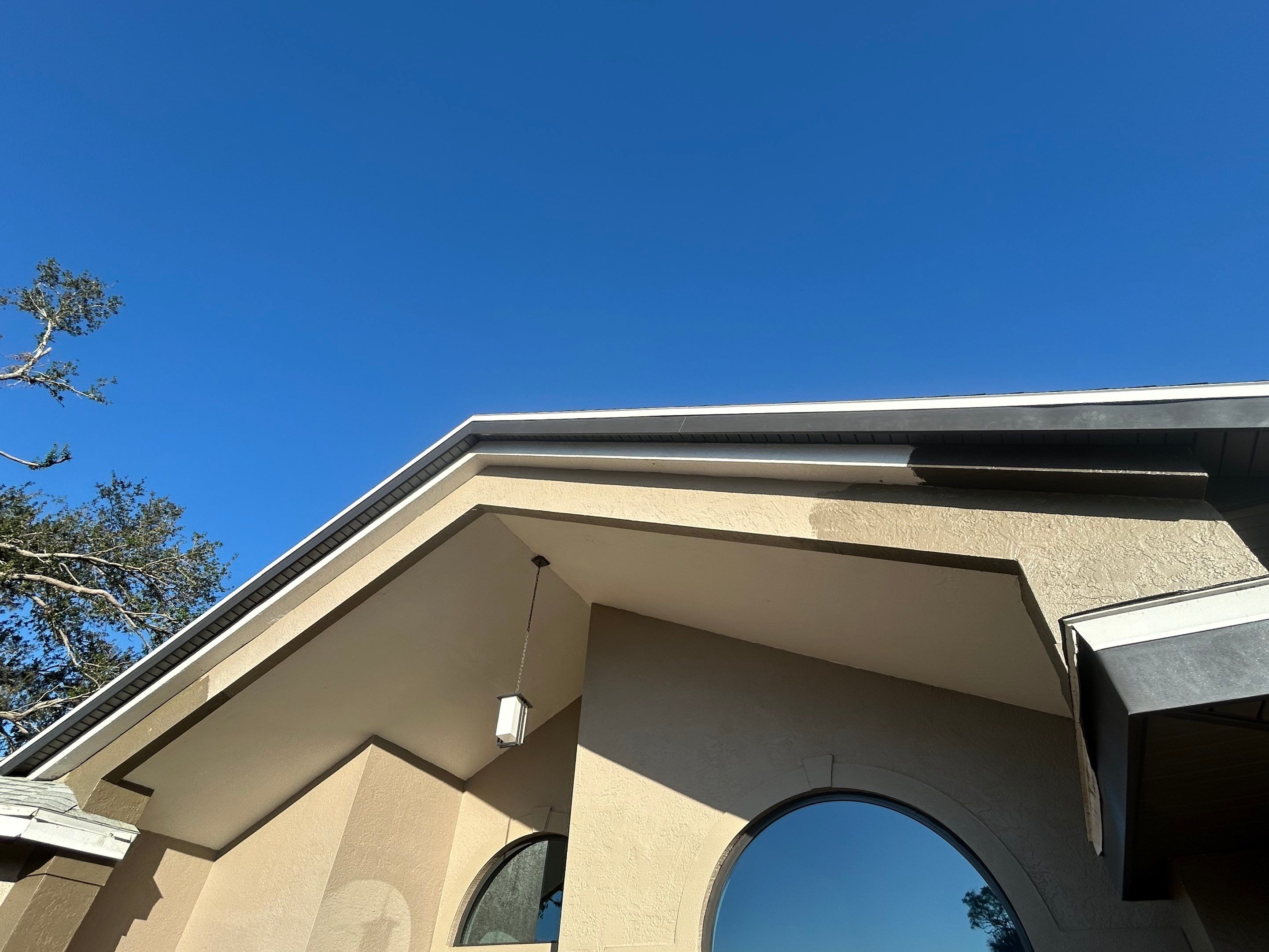 Black Seamless Gutters in Sarasota FL by Gutter Professors