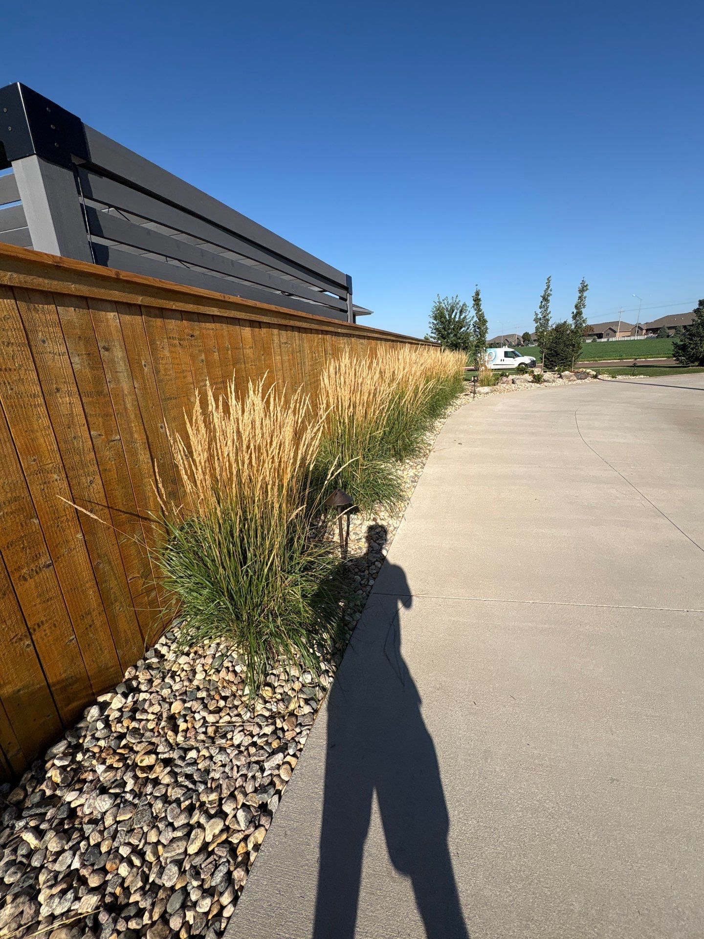 Custom Privacy Fence and Paver Patio Installation in Sioux Falls by Select Painting, Coatings & Garage Cabinets