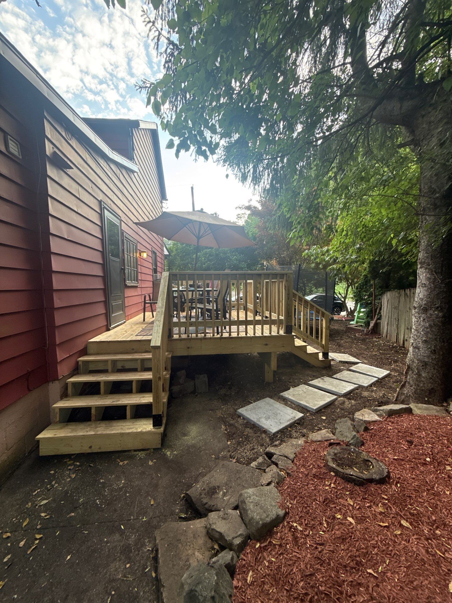 Roof sunspace deck  by Cousins Roofing Siding & Decks