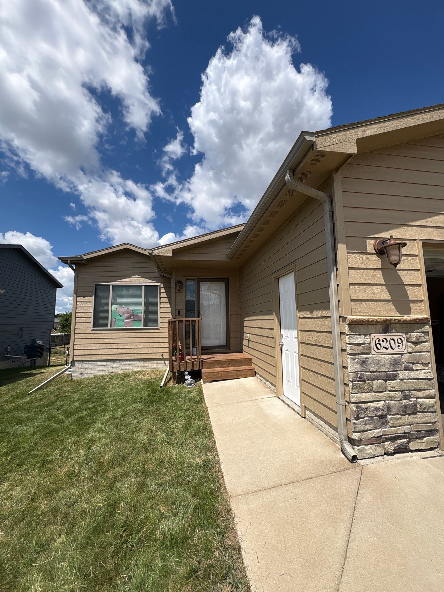 Exterior Painting and Custom Deck Construction in Sioux Falls by Select Painting, Coatings & Garage Cabinets