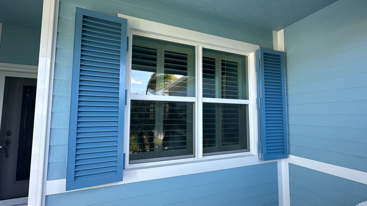 Hurricane Rated Shutters in Pastel Blue by Smart Guard Shutters