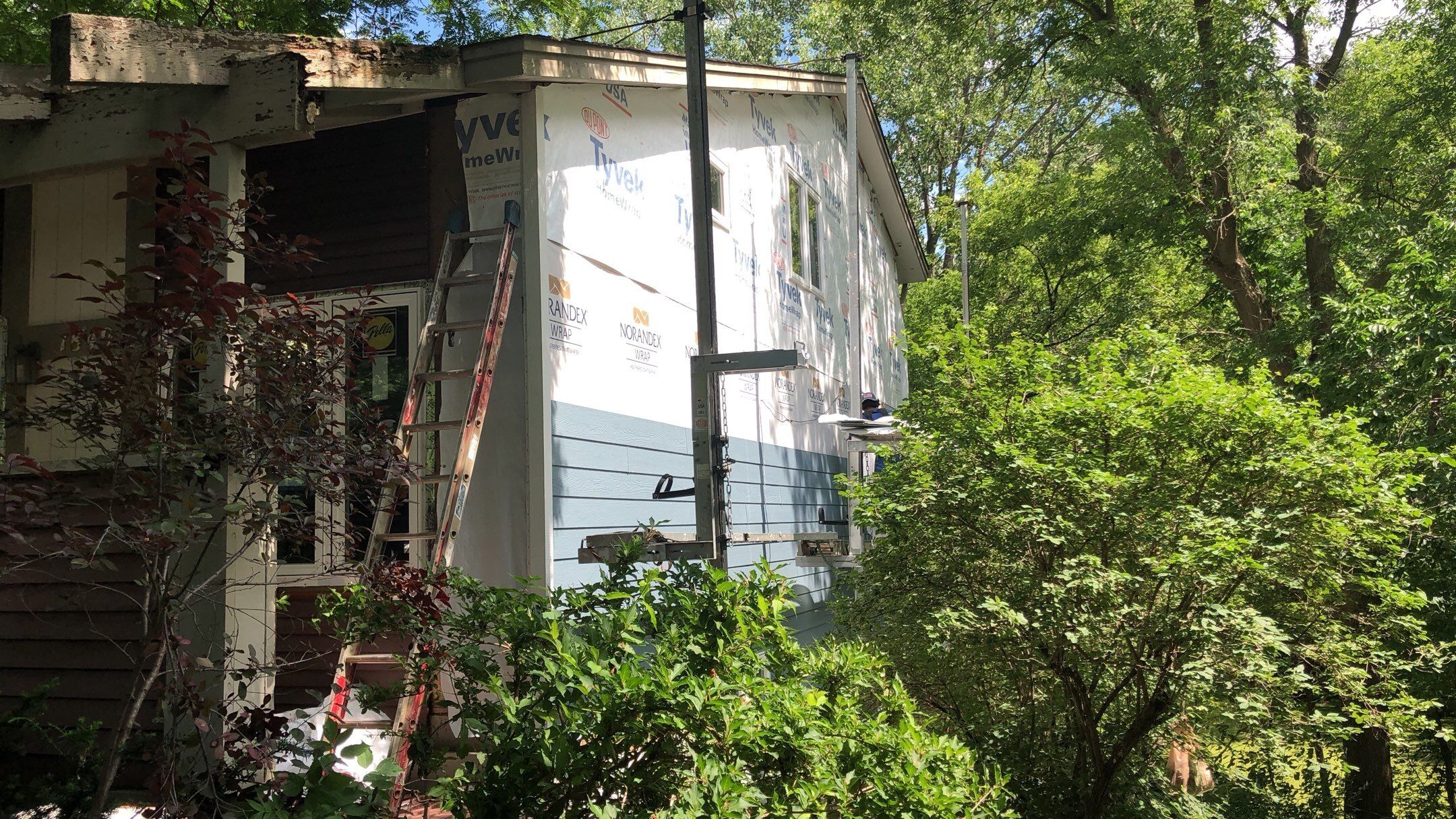 Siding Installation using LP SmartSide and Pella Vinyl Windows by MODERN EXTERIOR SYSTEMS