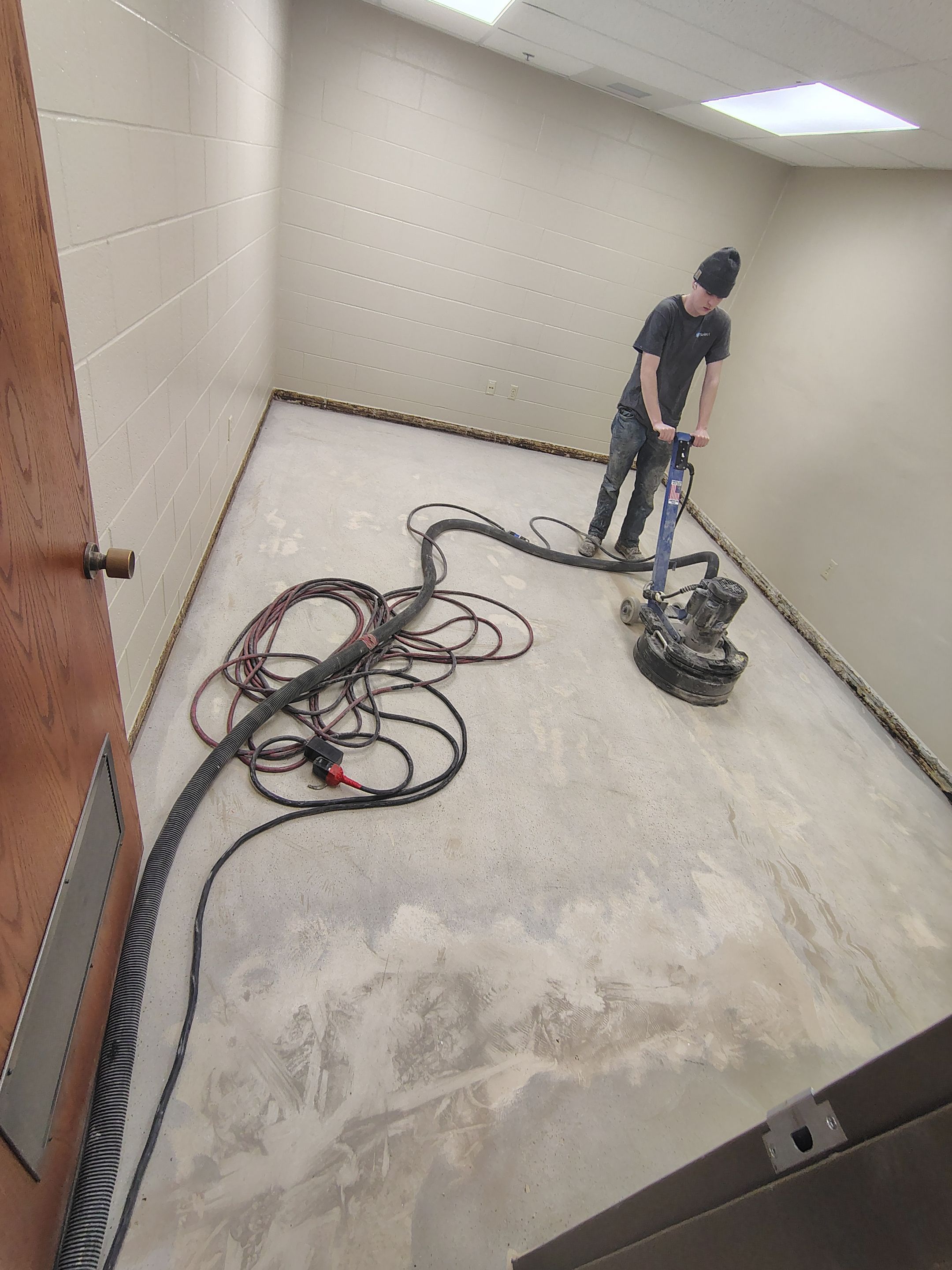 Industrial Flake Epoxy Floor Installation at Pierre National Guard Facility by Select Painting, Coatings & Garage Cabinets
