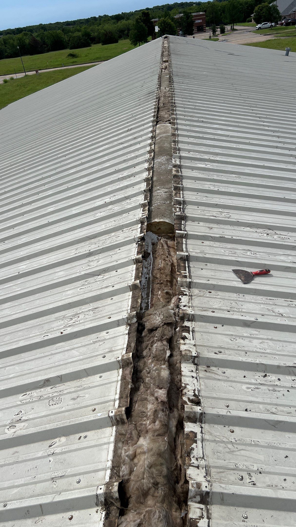Drainage System Installation and Metal Roof Repairs by Harvey Roofing & Construction