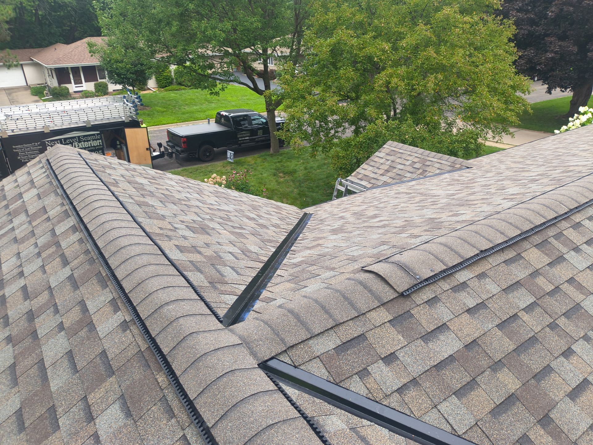 Owens Corning TruDefinition Roof Replacement with Gutters | Roseville, MN by Next Level Seamless Gutters / Exteriors Inc.