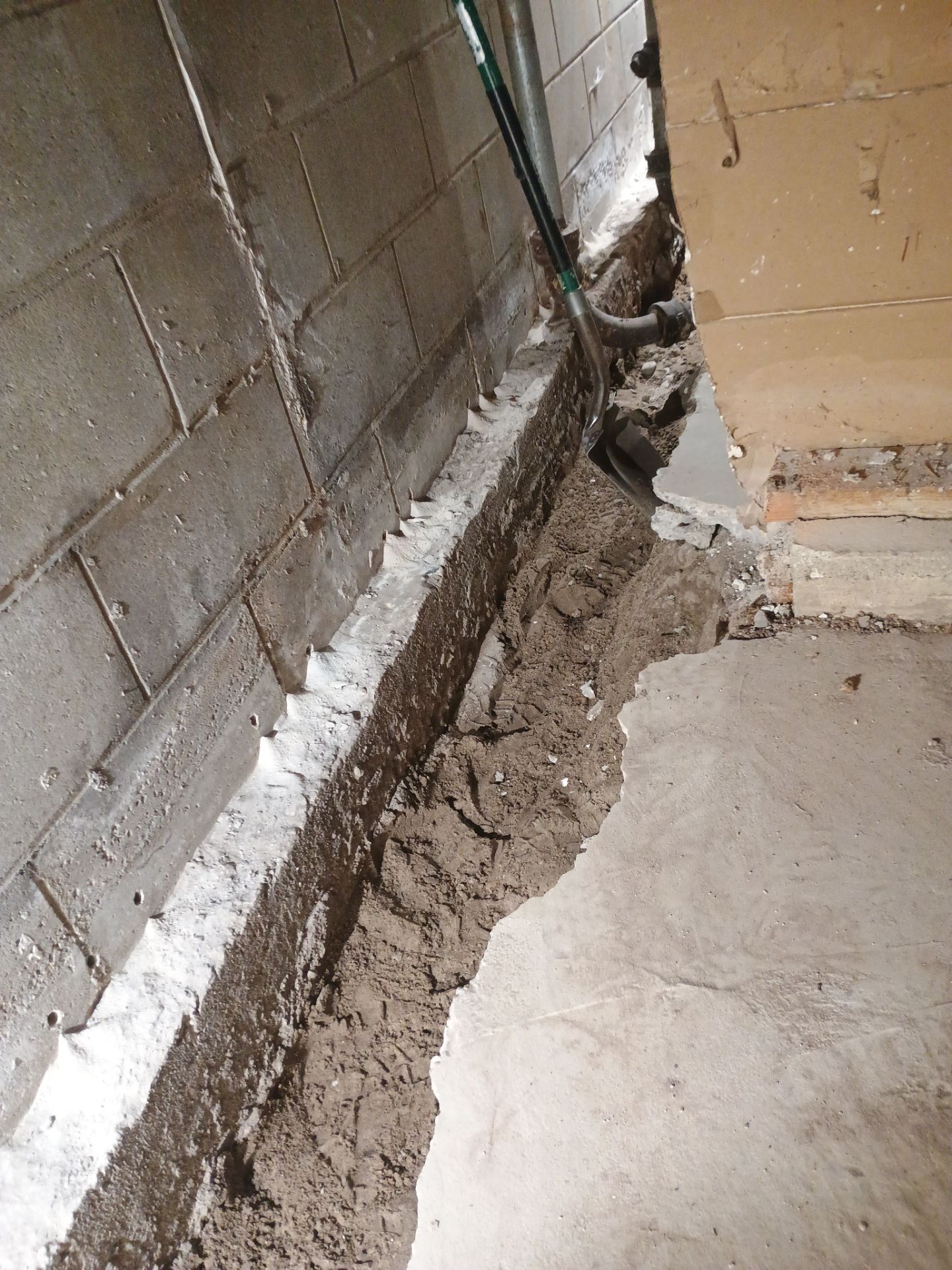 Interior Drain Tile & Buried Discharge in South Minneapolis by Waterproofing Northeast
