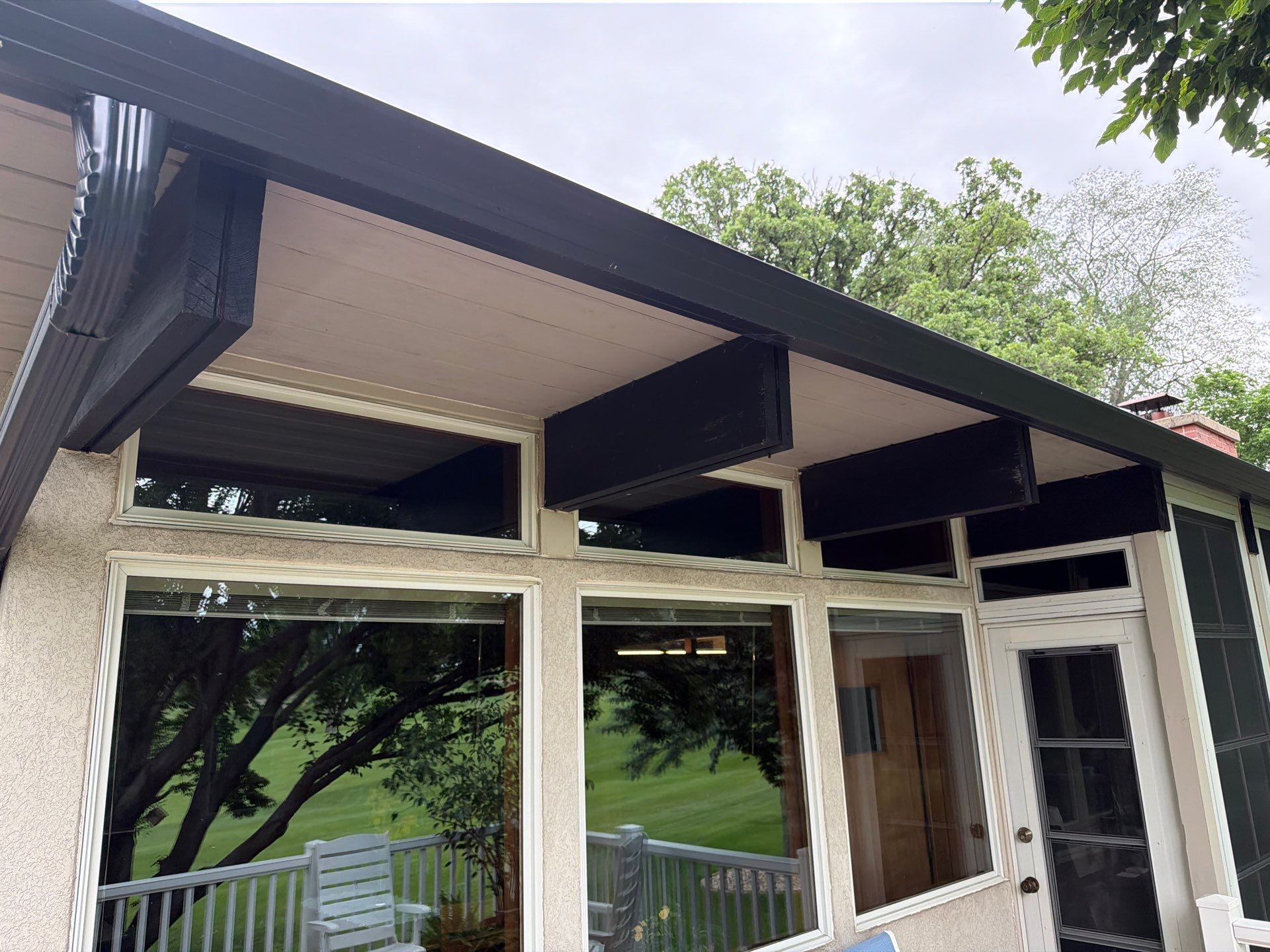 Exterior Trim Painting and Rafter Staining in Sioux Falls by Select Painting, Coatings & Garage Cabinets